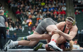 Mounds View's Quin Morgan (top) holds an advantage against Prior Lake's Brock Zurn during the Class 3A state championships.