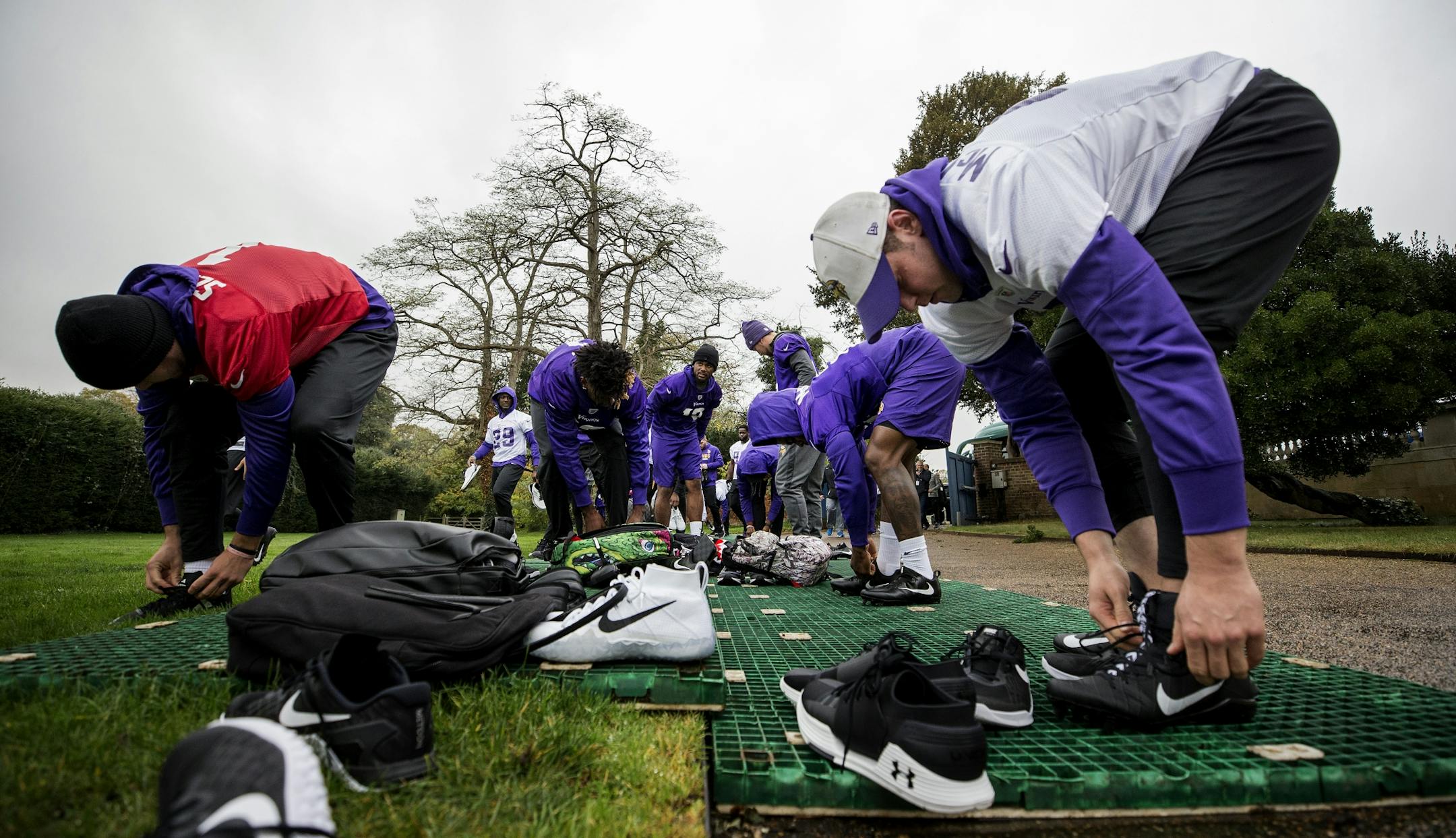 Minnesota Vikings players tied their shoes before practice at Syon House outside of London in preparation for a game vs. the Cleveland Browns.