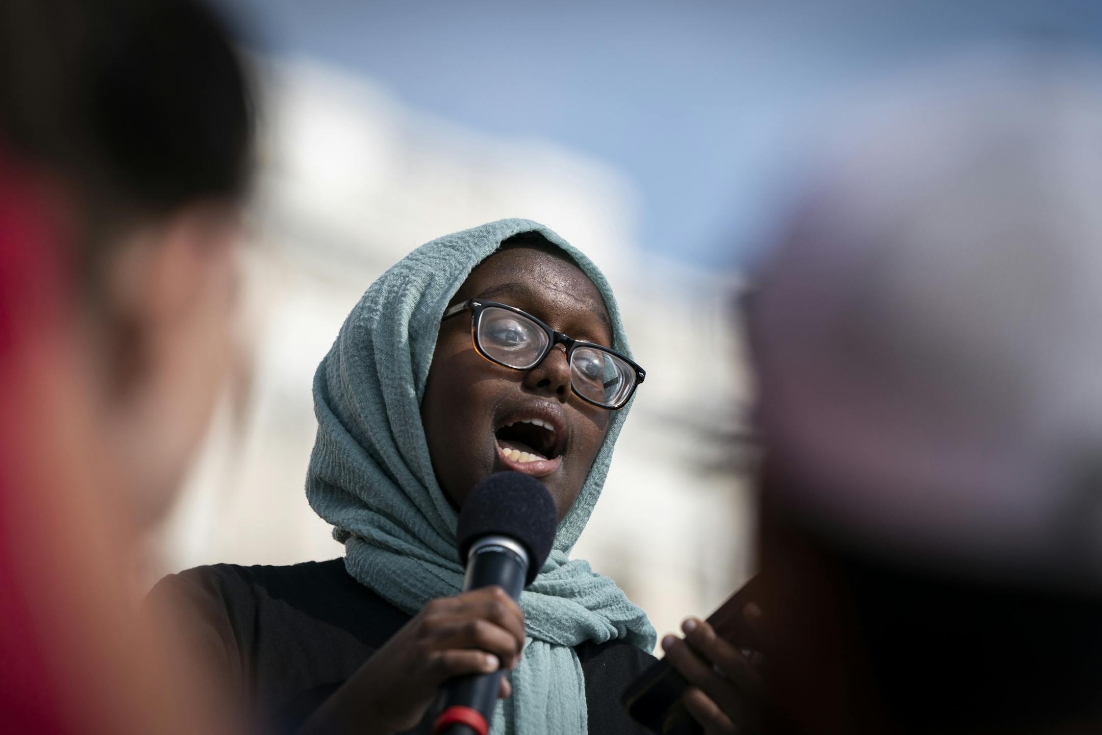 Juwaria Jama, 15, a local youth organizer, spoke during the rally at the Capitol.