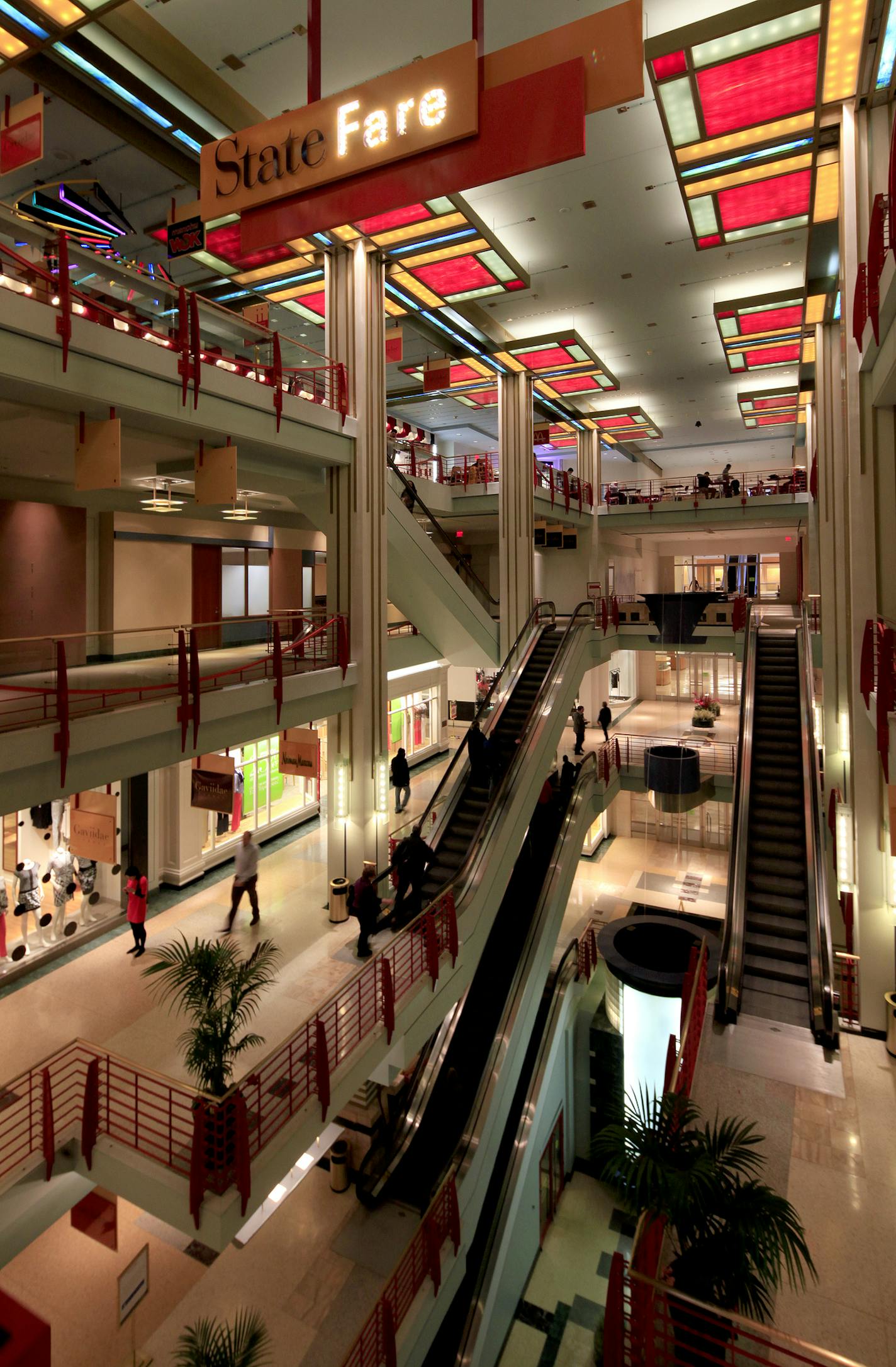 The State Fare food court, popular with time-pressed office workers, spans the fourth floor of Gaviidae II. "Many of the colors and finishes are dated and in need of a face-lift," the building's new owner says.