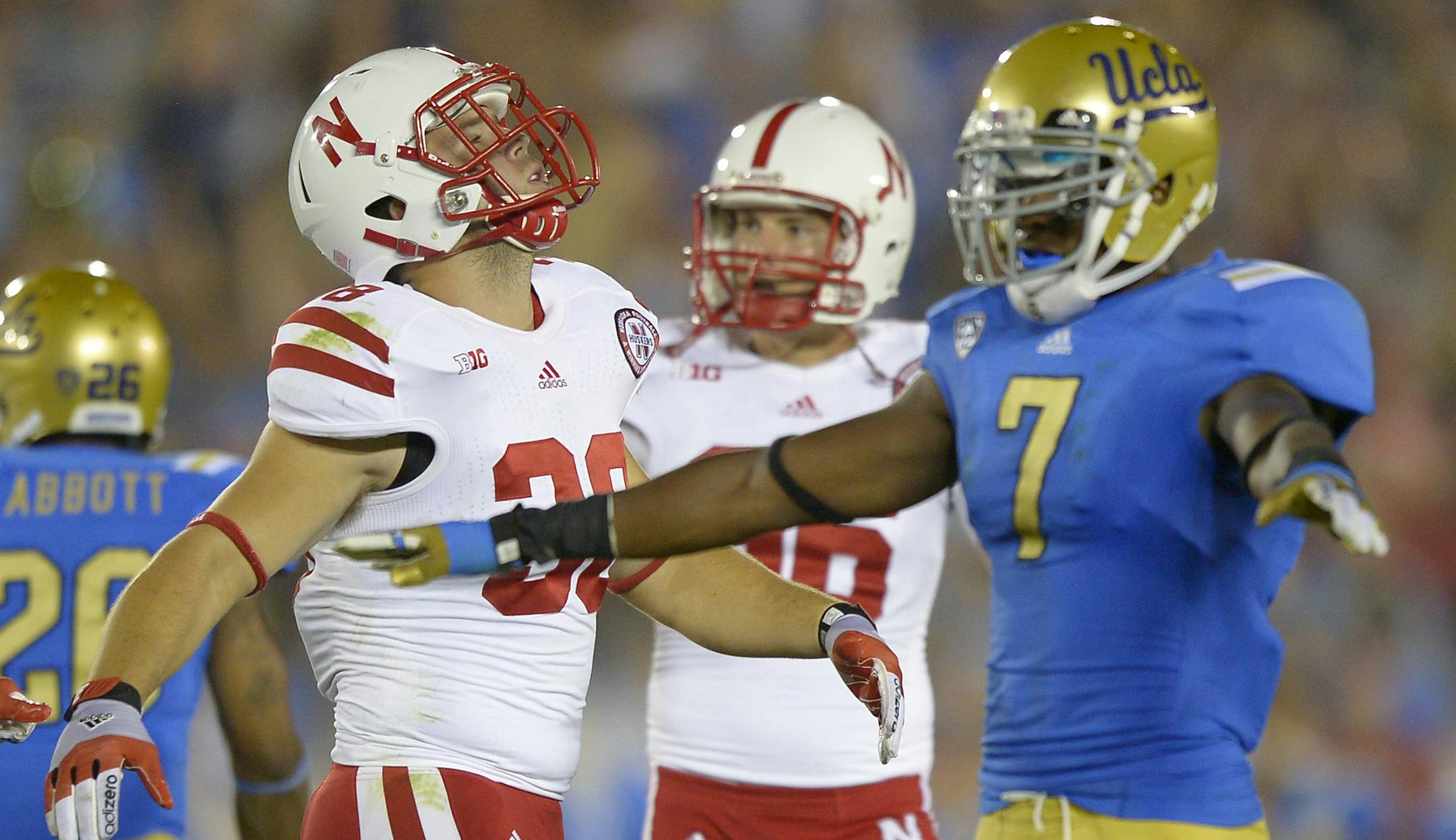 Nebraska linebacker Aaron Gabriel, left, and kicker Brett Maher react after they missed a field goal as UCLA safety Tevin McDonald gestures during the second half of their NCAA football game, Saturday, Sept. 8, 2012, in Pasadena, Calif. UCLA won 36-30. (AP Photo/Mark J. Terrill) ORG XMIT: NYOTK