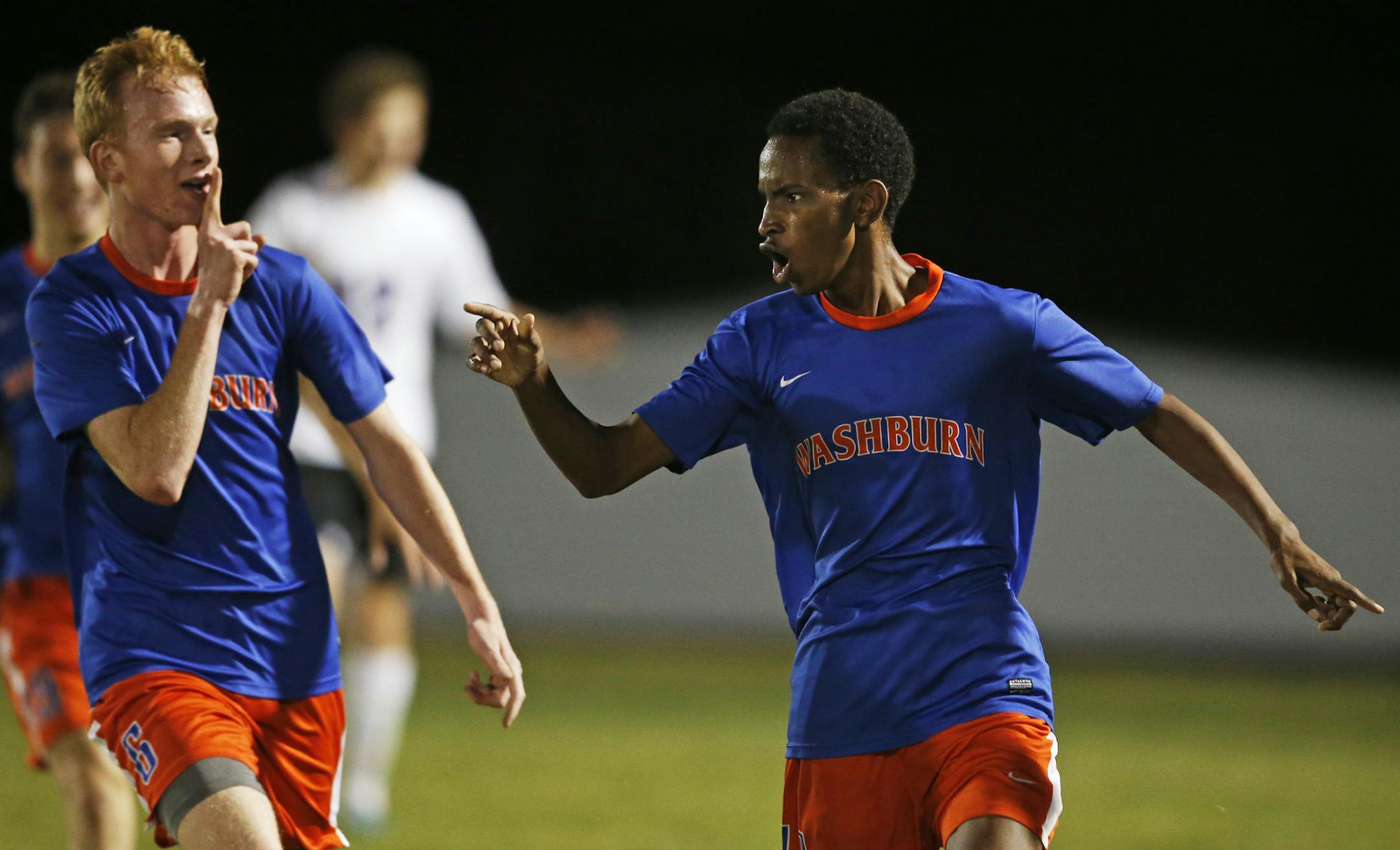 At Southwest H.S. in the AA Section 6 final game against Washburn, Kevin Lowen(6) celebrated with Hassan Adan(11) who scored the winning goal for Washburn.] Richard Tsong-Taatarii/rtsong-taatarii@startribune.com