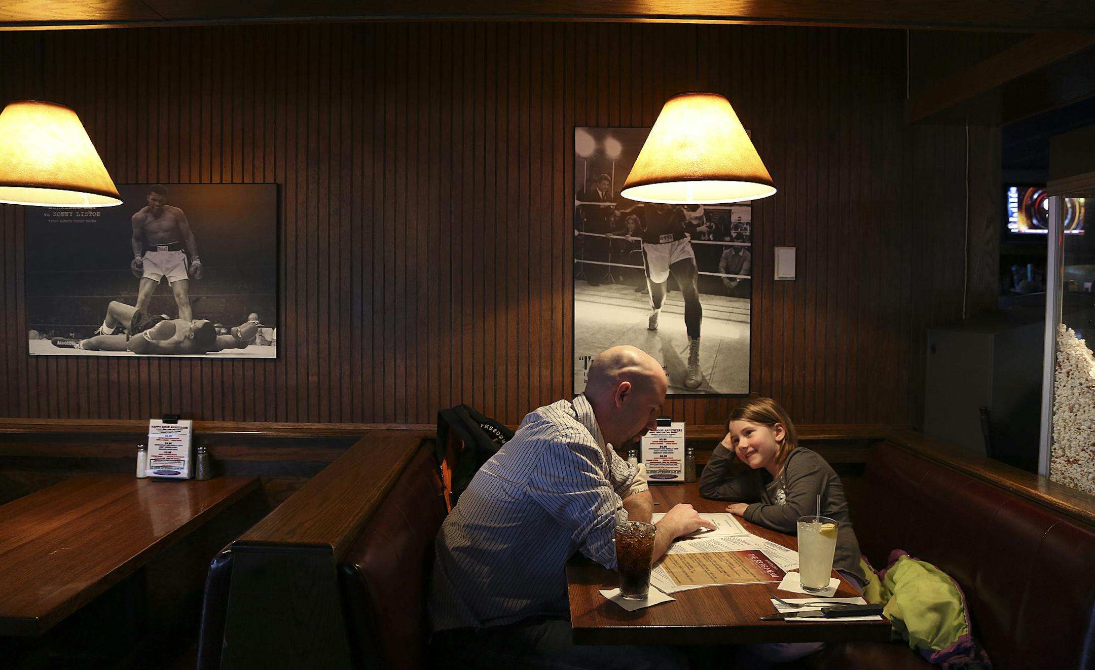 Dan Hager and his daughter Lydia, 5, try to decided what to eat at The Sunshine Factory, a wildly popular neighborhood restaurant in New Hope, Min., Tuesday, April 9, 2013. The restaurant plans to move a few miles west from its present location this summer. ] (KYNDELL HARKNESS/STAR TRIBUNE) kyndell.harkness@startribune.com