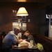 Dan Hager and his daughter Lydia, 5, try to decided what to eat at The Sunshine Factory, a wildly popular neighborhood restaurant in New Hope, Min., T
