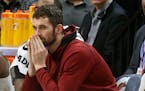 FILE - In this Jan. 8, 2018, file photo, Cleveland Cavaliers' Kevin Love watches from the bench in the second half of an NBA basketball game against t