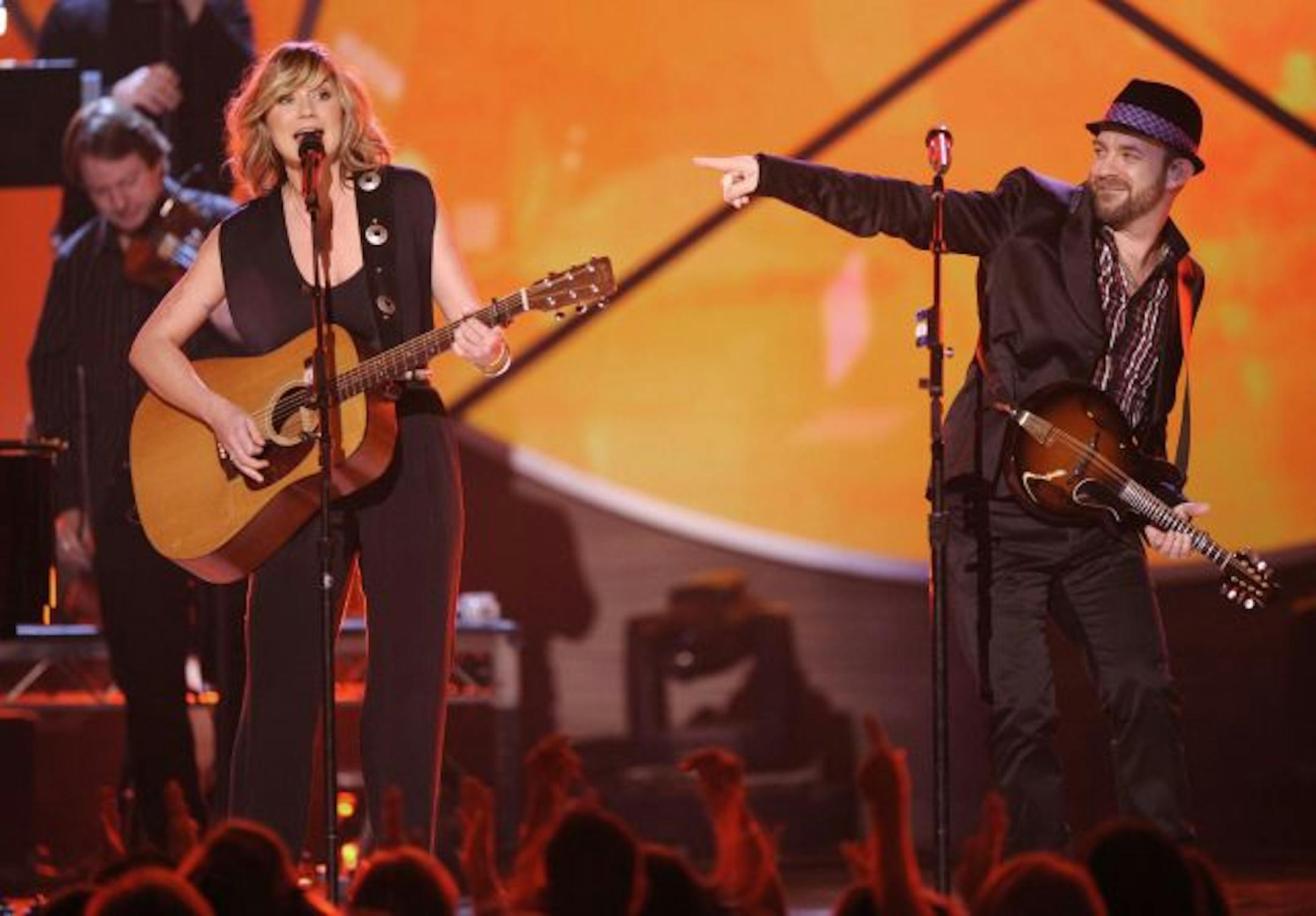 Jennifer Nettles, left, and Kristian Bush, of Sugarland, perform "Adalida" at the ACM Artist of the Decade All Star Concert in honor of George Strait on Monday, April 6, 2009, in Las Vegas.