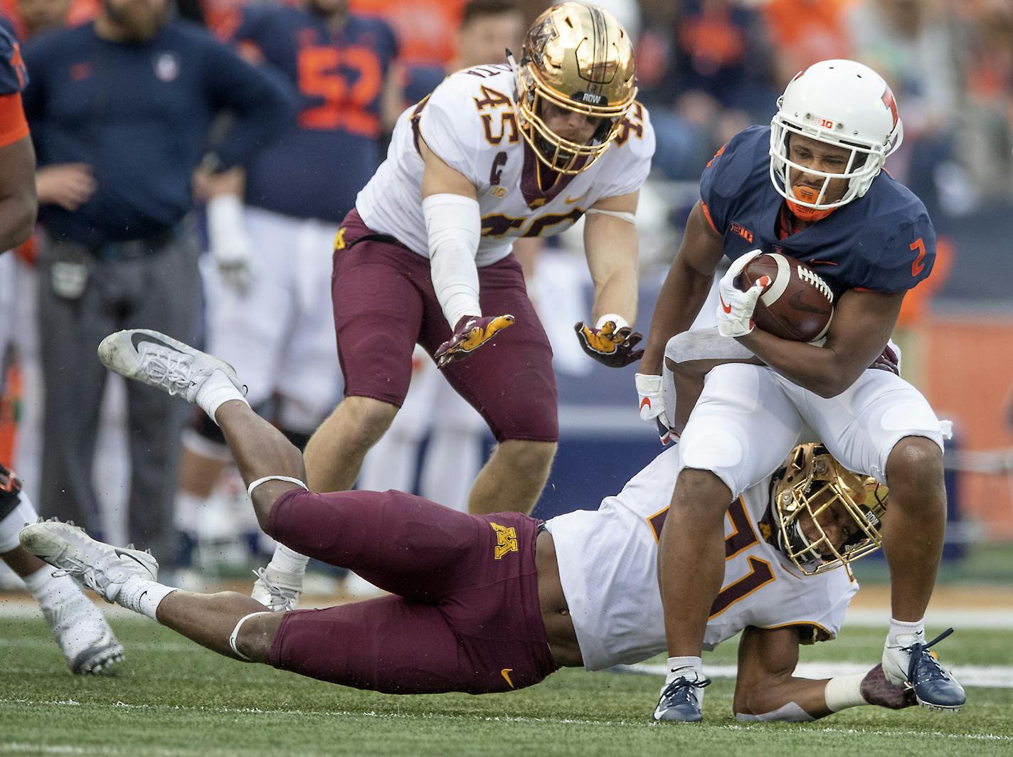 Illinois running back Reggie Corbin rushed with the ball despite defensive pressure by Minnesota's linebacker Kamal Martin during the second quarter as the Gophers took on Illinois at Memorial Stadium, Saturday, November 3, 3018 in Champaign, IL. ] ELIZABETH FLORES &#xef; liz.flores@startribune.com