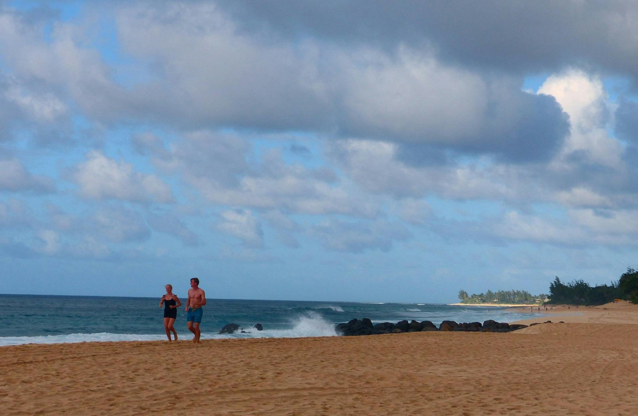 Morning joggers on the beach on Oahu's North Shore. (Brian J. Cantwell/Seattle Times/TNS)