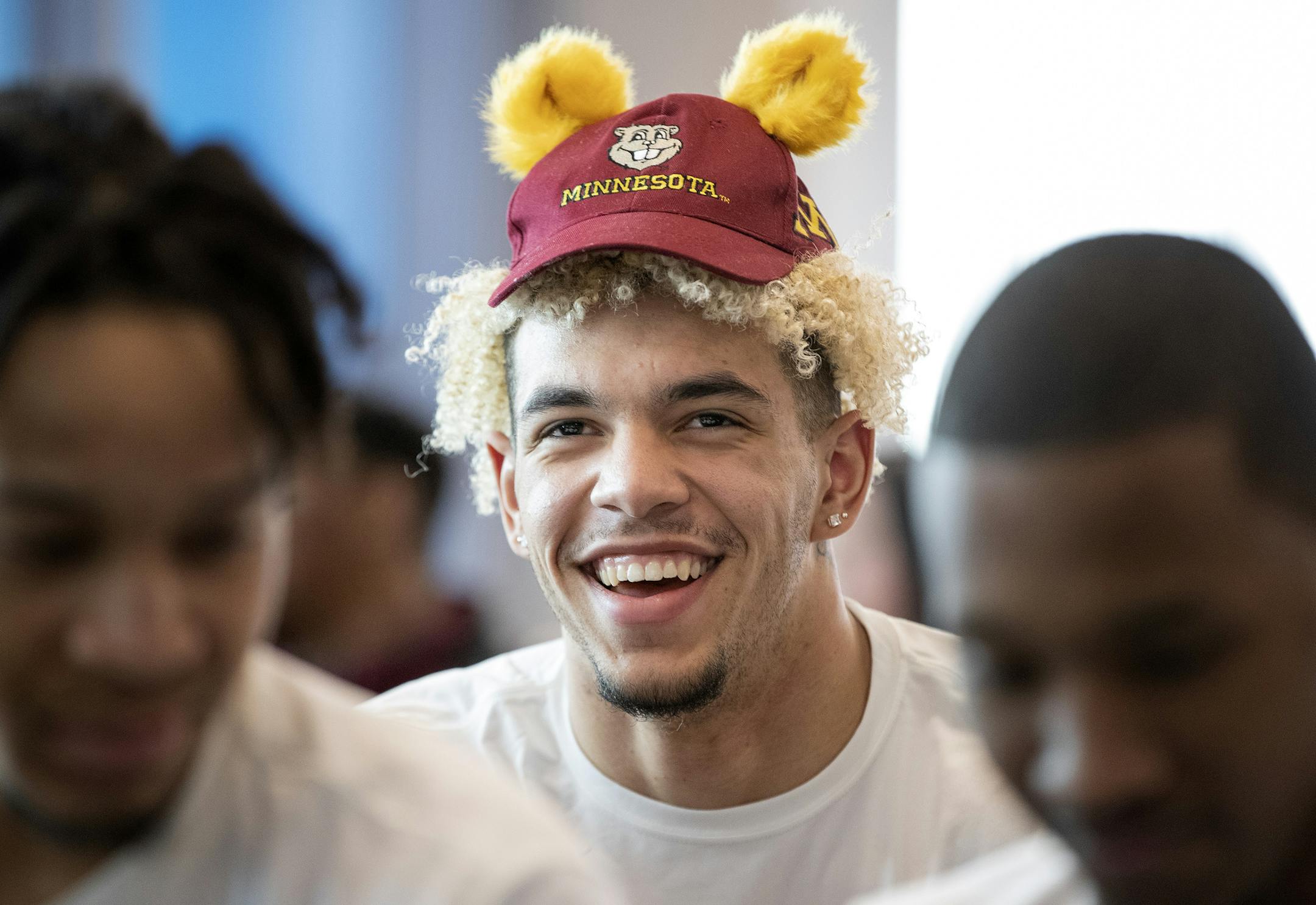 Jarvis Omersa wore a small Gophers hat while waiting for the NCAA tournament announcements with teammates at the Athletes Village. ] CARLOS GONZALEZ &#x2022; cgonzalez@startribune.com &#x2013; Minneapolis, MN &#x2013; March 17, 2019, University of Minnesota Gophers basketball, selection Sunday.