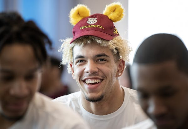 Jarvis Omersa wore a small Gophers hat while waiting for the NCAA tournament announcements with teammates at the Athletes Village. ] CARLOS GONZALEZ &