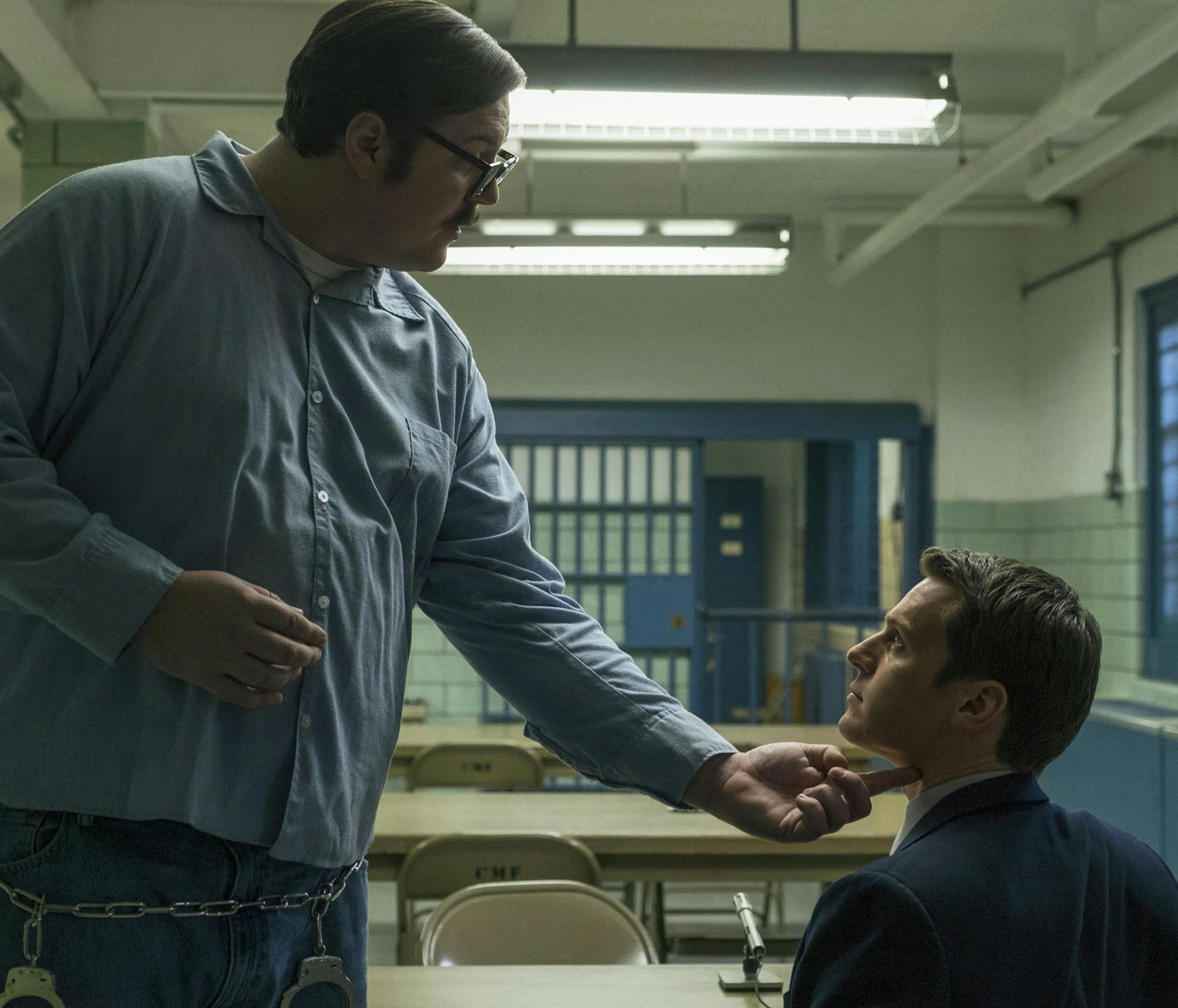 This image released by Netflix shows Cameron Britton, left, and Jonathan Groff in a scene from the 10-episode series, "Mindhunter," streaming on Netflix starting Friday. (Merrick Morton/Netflix via AP)