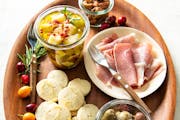 Homemade Rosemary-Lemon Shortbread, marinated cheese and spicy mixed nuts are supplemented with store-bought charcuterie for a festive appetizer board