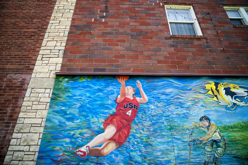 Lindsay Whalen is part of a mural painted on the side of Security Coin & Pawn Shop in downtown Hutchinson, where she grew up.