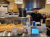 Francesco Gambino, owner of Andrea Pizza, in his skyway restaurant on March 12. "For us, if people don't come to work," he said, "that's tragic."