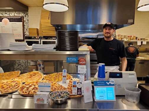 Francesco Gambino, owner of Andrea Pizza, in his skyway restaurant on March 12. "For us, if people don't come to work," he said, "that's tragic."