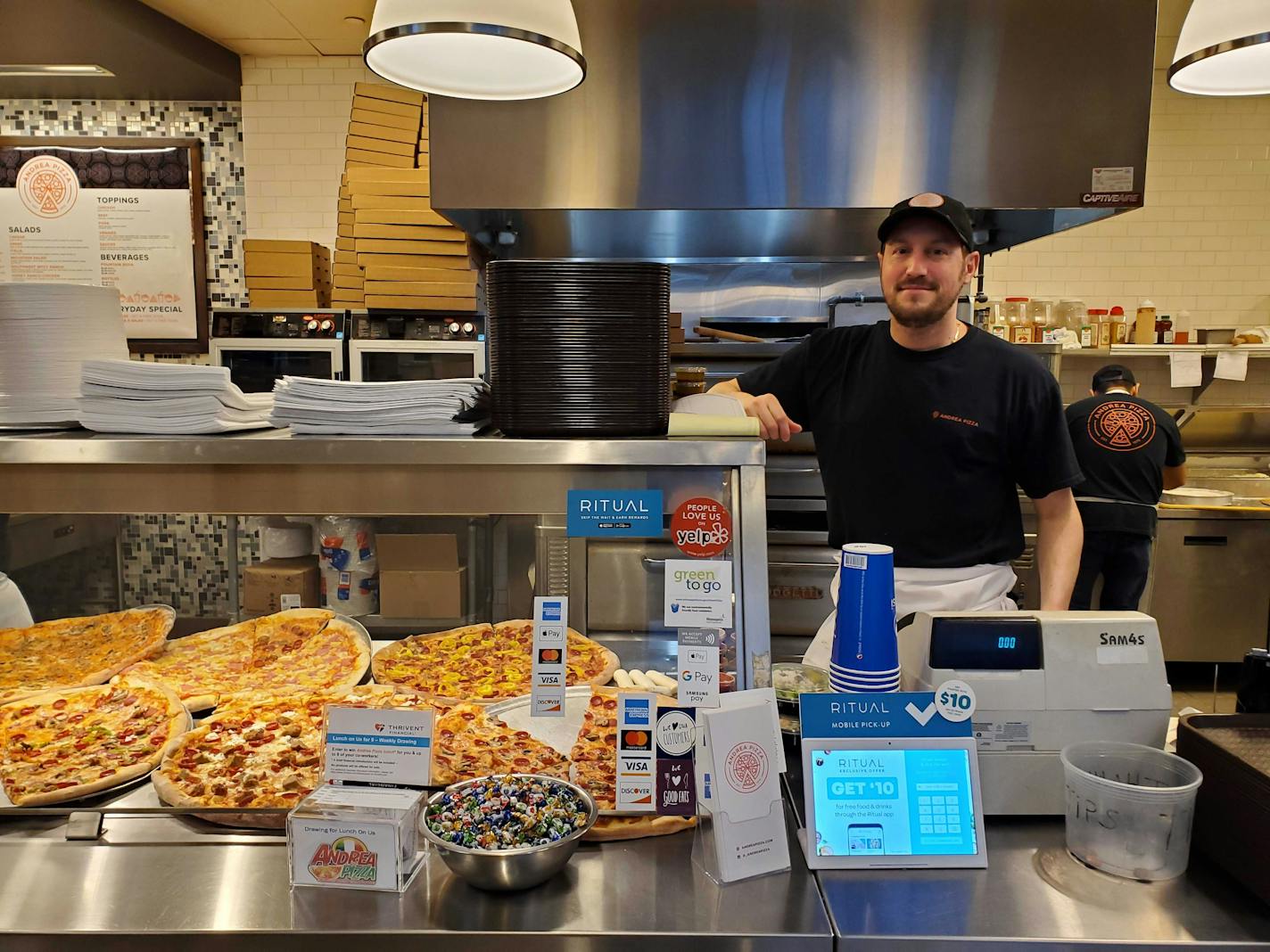 Francesco Gambino, owner of Andrea Pizza, in his skyway restaurant on March 12. "For us, if people don't come to work," he said, "that's tragic."