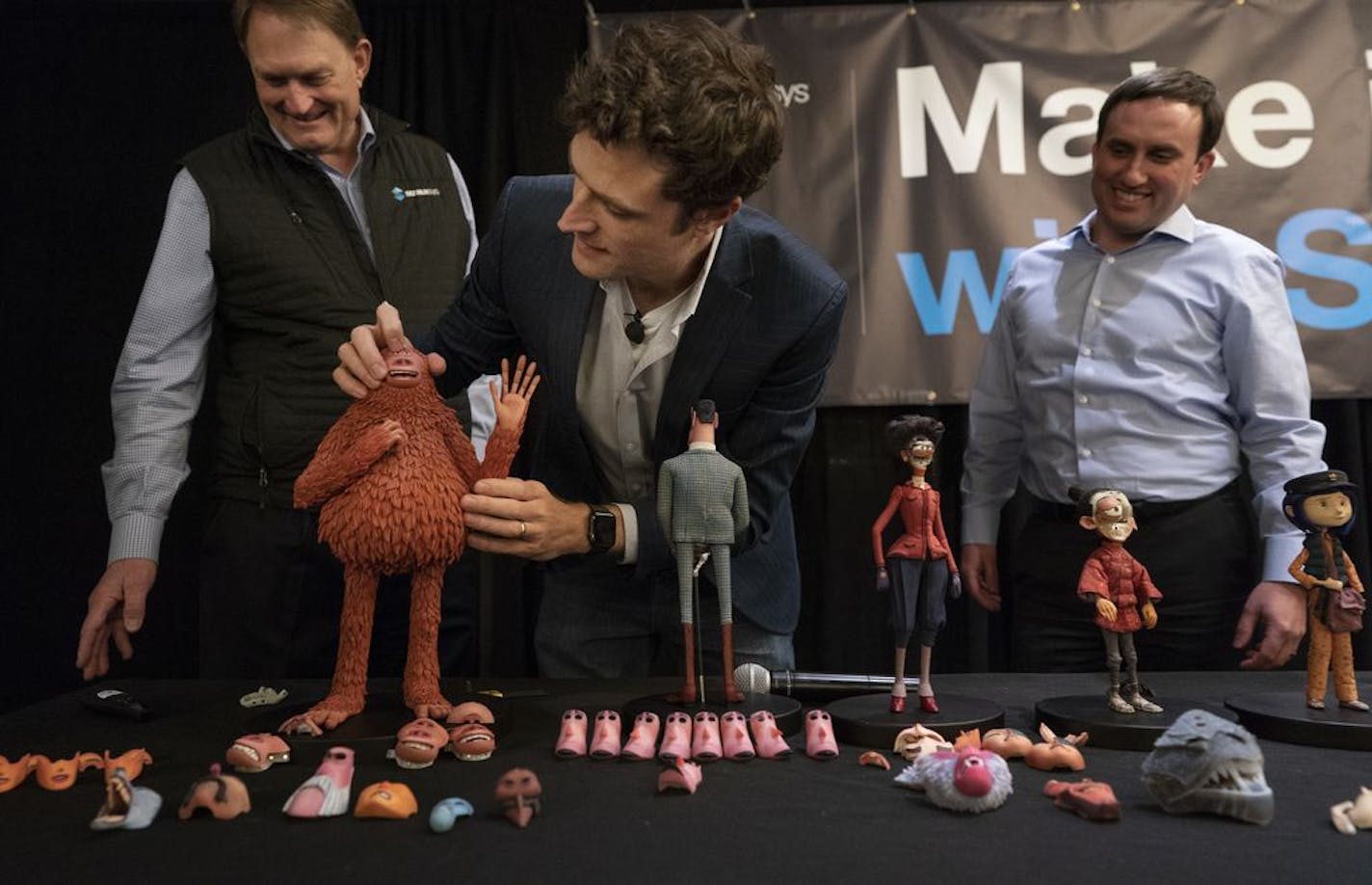 Brian McLean, center, director of rapid prototype at Laika, Scott Crump, left, co-founder of Stratasys, and Rich Garrity, president of Stratasys Americas, looked at characters from "The Missing Link."