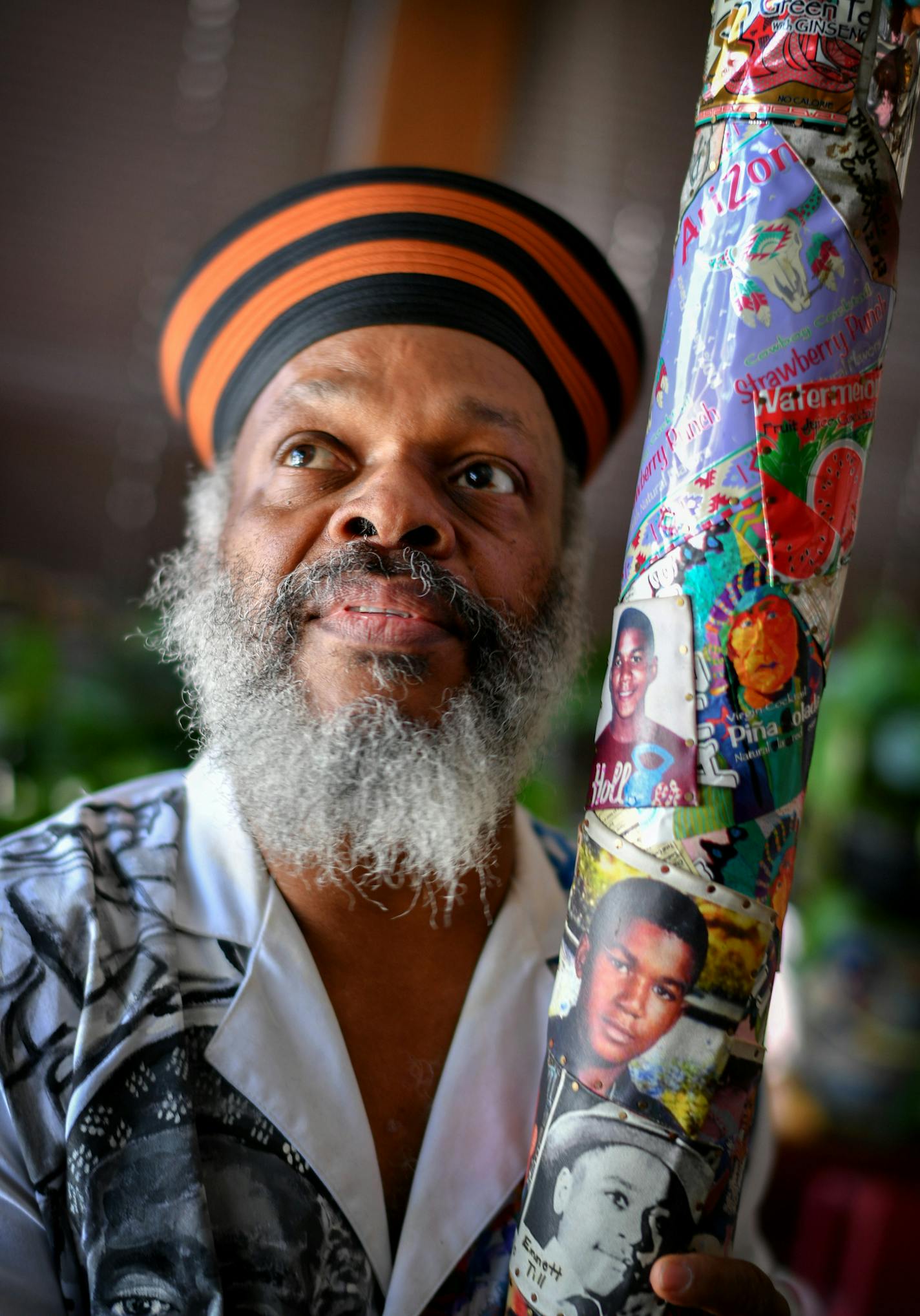 Ewart with the 7-foot rain stick he created in honor of Trayvon Martin.