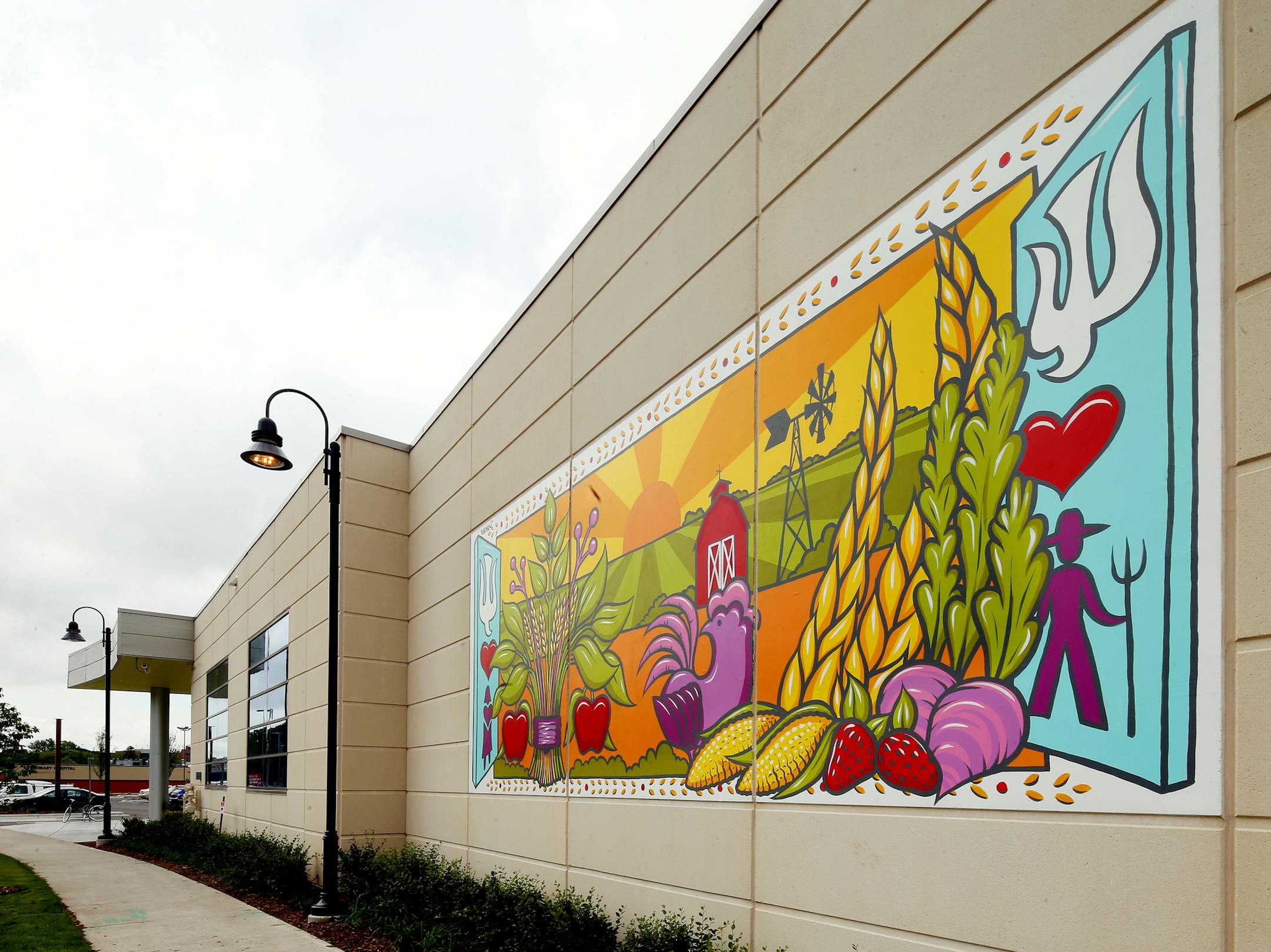 Artist Adam Turman painted a mural on the exterior of Lakewinds Co-op. ] JOELKOYAMA‚Ä¢jkoyama@startribune Richfield, MN on June 18, 2014.