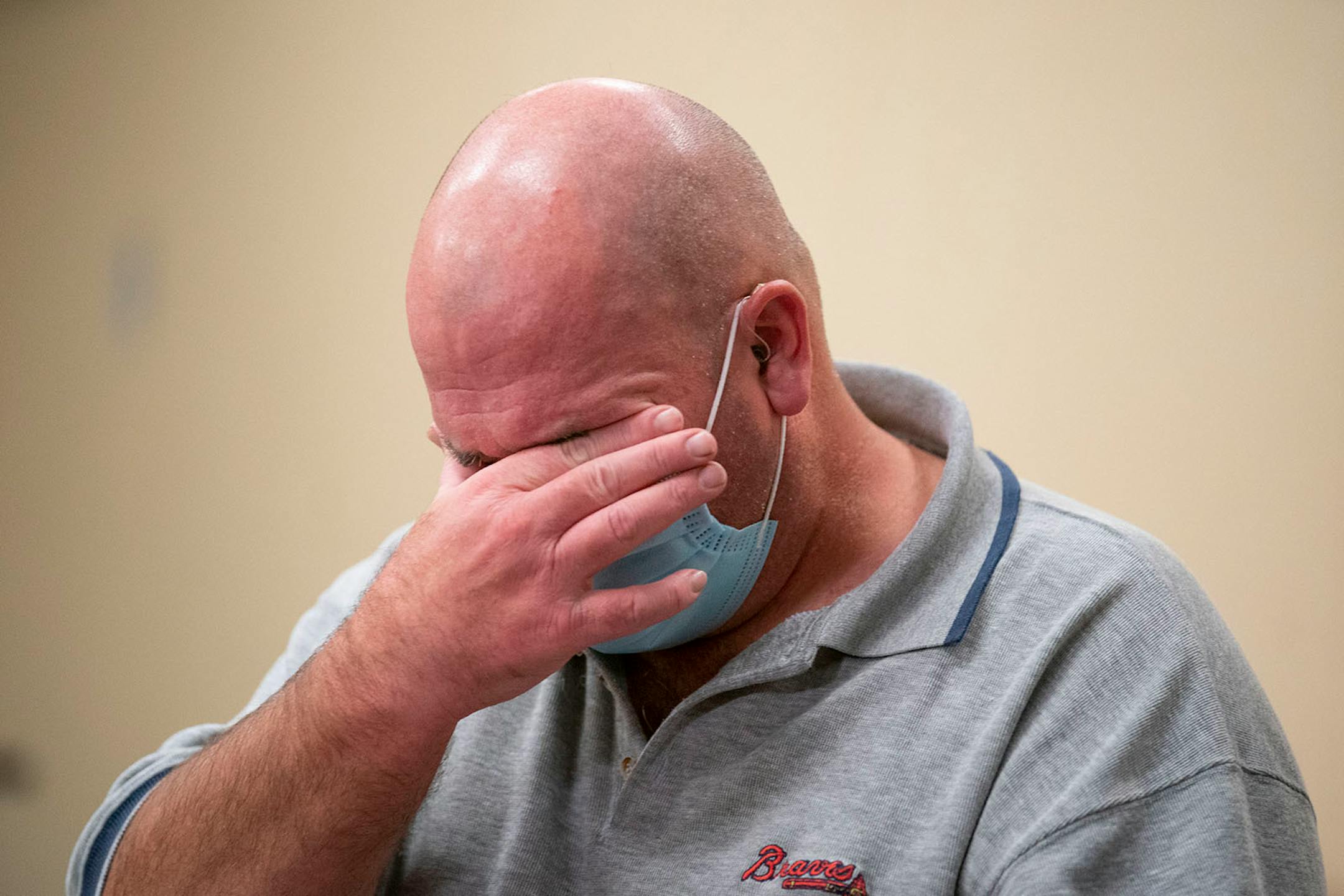Tim White wiped tears from his eyes as spoke about his experience battling COVID-19 and ARDS at Essentia Health-St. Mary's Medical Center in Duluth on Friday October 16, 2020.