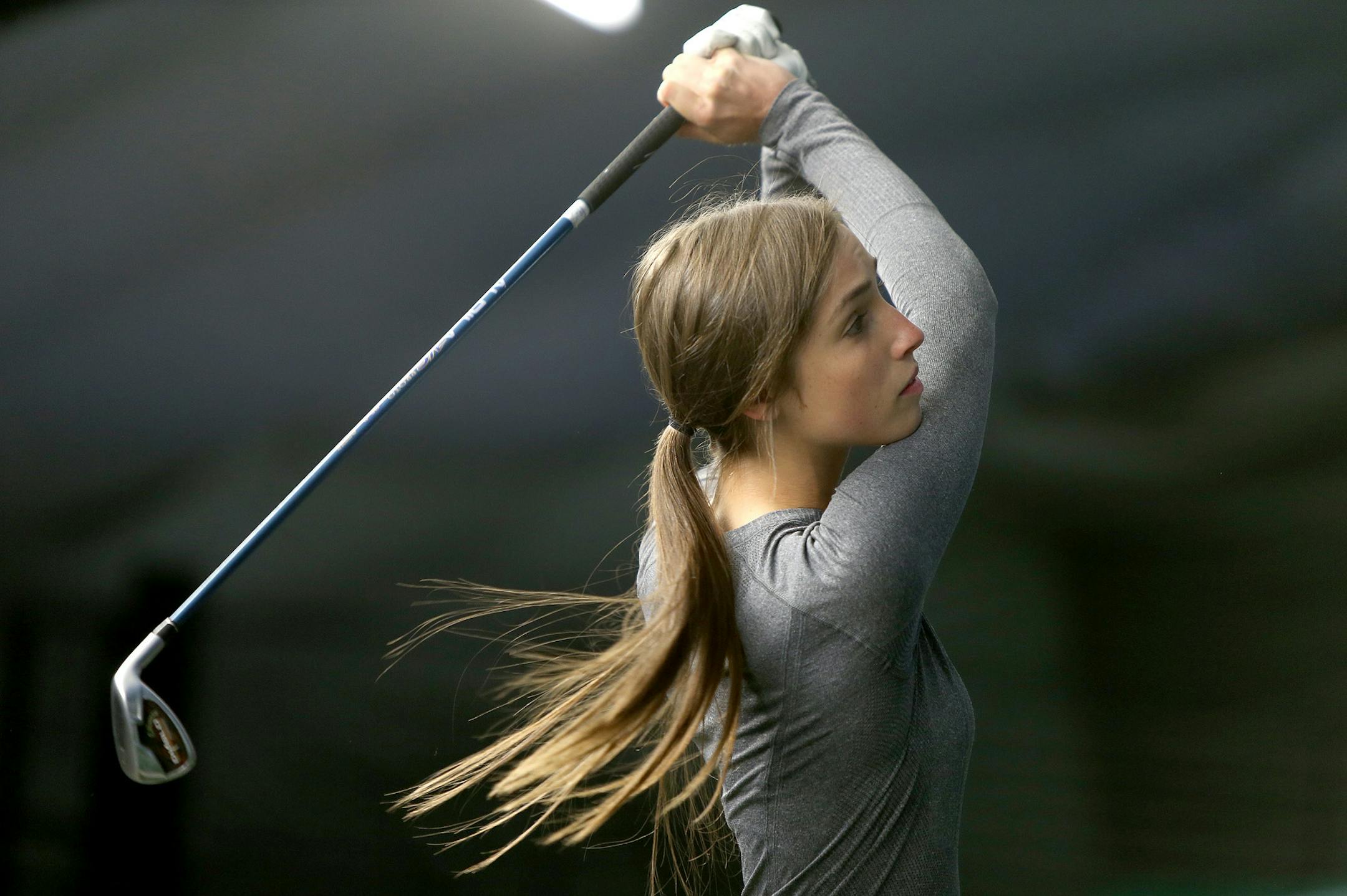 Edina senior Emily Romanow practiced at the Braemar Golf Dome, Tuesday, March 25, 2014 in Edina, MN. ] (ELIZABETH FLORES/STAR TRIBUNE) ELIZABETH FLORES • eflores@startribune.com