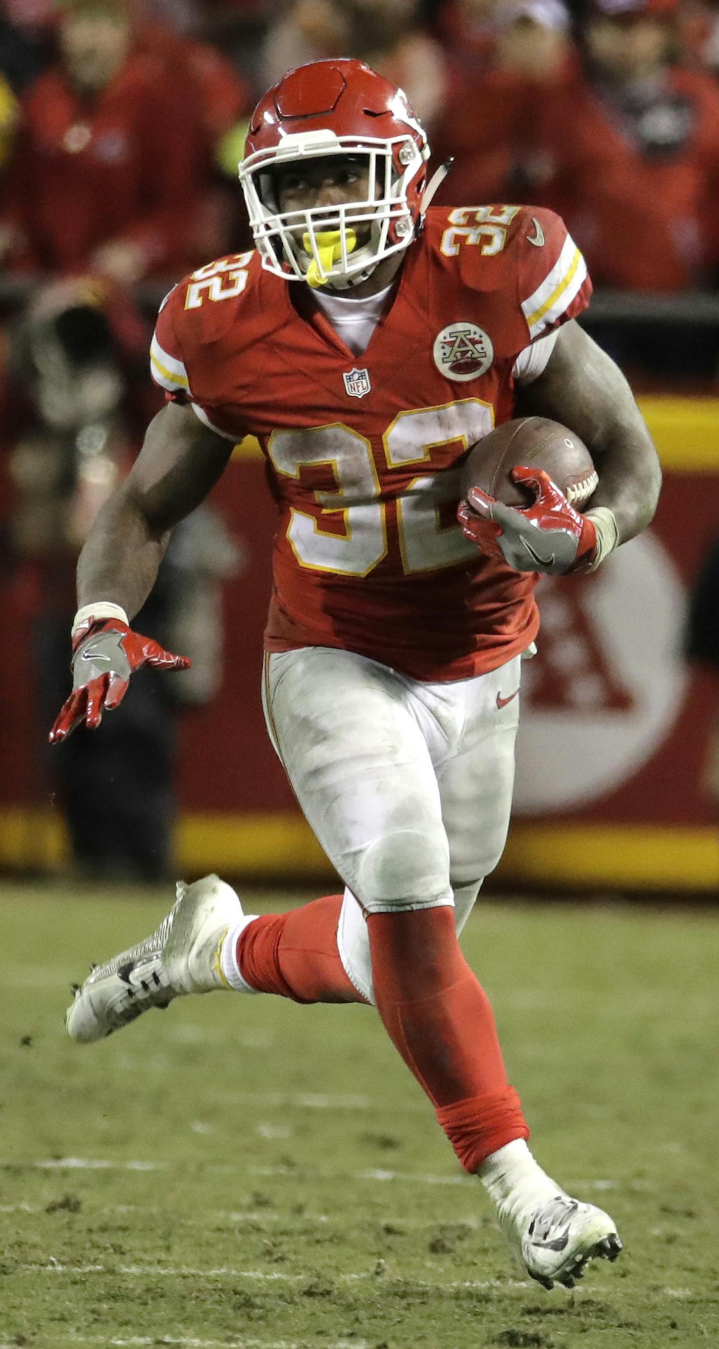 Kansas City Chiefs running back Spencer Ware (32) carries the ball during the first half of an NFL football game against the Denver Broncos in Kansas City, Mo., Sunday, Dec. 25, 2016. (AP Photo/Charlie Riedel) ORG XMIT: OTKOW