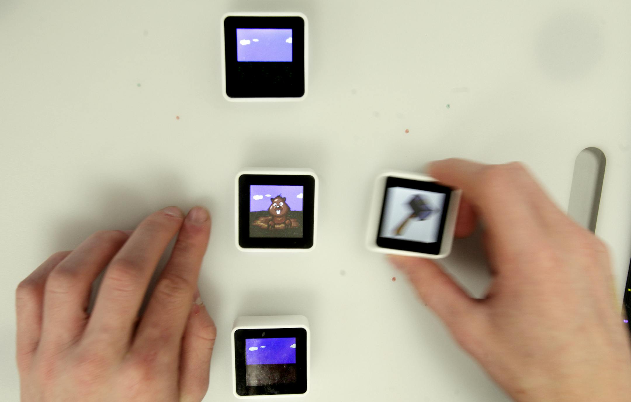 Noah Madson plays a game after Site Coordinator Kent Hranicka of CogCubed explained the rules of the game at Groves Academy in St. Louis Park, MN. CogCubed has attracted funding from Google for its video games that help diagnose disorders such as ADHD and autism. The company is partnering with Groves Academy, a school for children with learning disabilities, to see if the games can also improve cognitive function. A Groves student with ADHD, part of the CogCubed pilot study, will be playing the