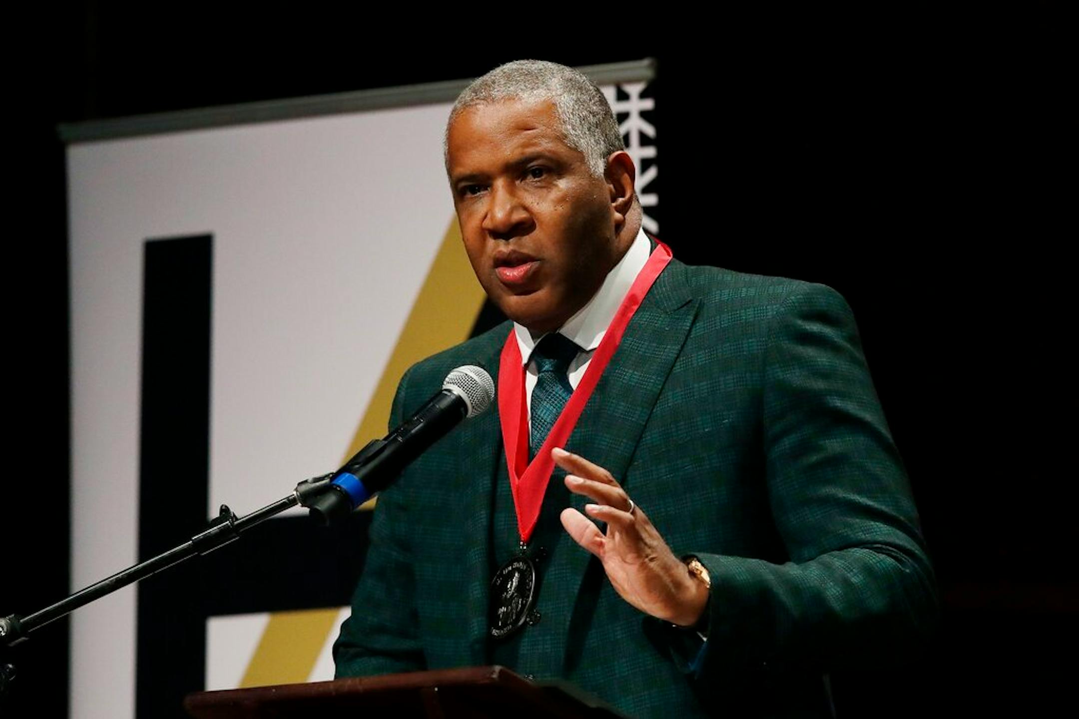 FILE - In this Oct. 22, 2019, file photo, billionaire businessman Robert F. Smith speaks after receiving the W.E.B. Dubois Medal for contributions to black history and culture, during ceremonies at Harvard University in Cambridge, Mass. Federal prosecutors have charged Houston billionaire Robert Brockman, not seen, with $2 billion tax fraud in largest such fraud case against an American. Prosecutors also announced Thursday, Oct. 15, 2020, that Robert Smith, founder and chairman of investment firm Vista Equity Partners, will cooperate in the investigation and pay $139 million to settle a tax probe. (AP Photo/Elise Amendola, File)