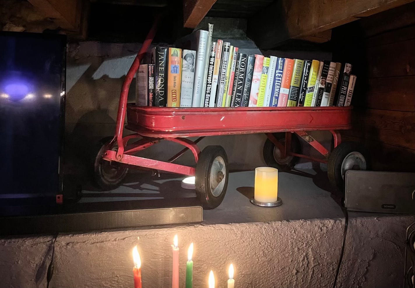 Tim Herbstrith finished the basement of his south Minneapolis home and created a 'speakeasy' decorated with repurposed family heirlooms including his grandma's red wagon and dad's bowling ball and shoes.