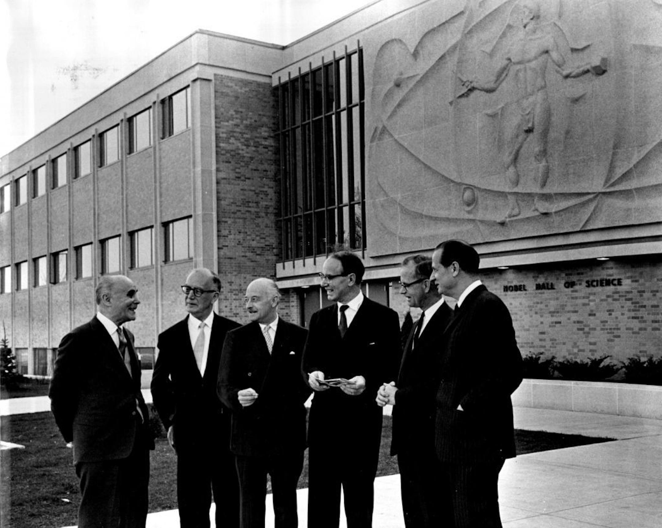 May 4, 1963 Nobel Lineup - Shown gathered before the new Nobel Hall of Science which Gustavus Adolphus College is dedicating today in St. Peter, Minn., are (from left) Dr. Andre F. Cournard, Columbia University, Nobel winner in medicine in 1956; Prof. Bertil Lindblad, Stockholm, Sweden, member of the Nobel Foundation; Dr. Nils Stahle, Stockholm, director of the Nobel Fundation; Dr. Arne Tiselius, Uppsala, Sweden, president of the Nobel Foundation and Nobel winner in chemistry in 1948; Dr. Edgar