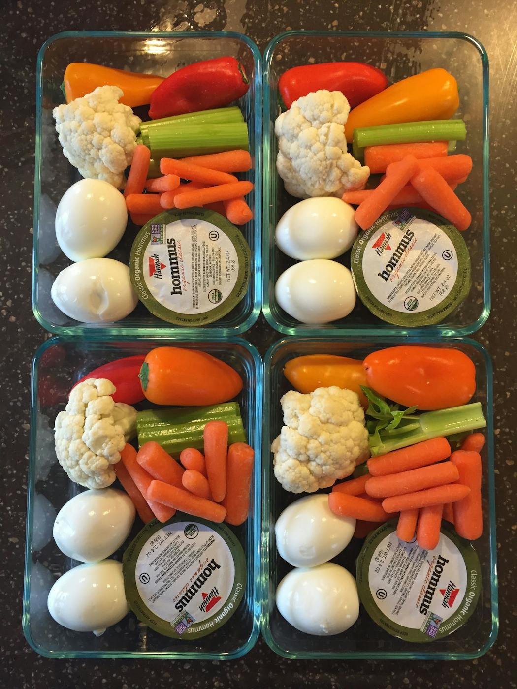 Professional organizer and chef Joor Erin stores healthy snack plates in uniform-sized rectangular glass containers.