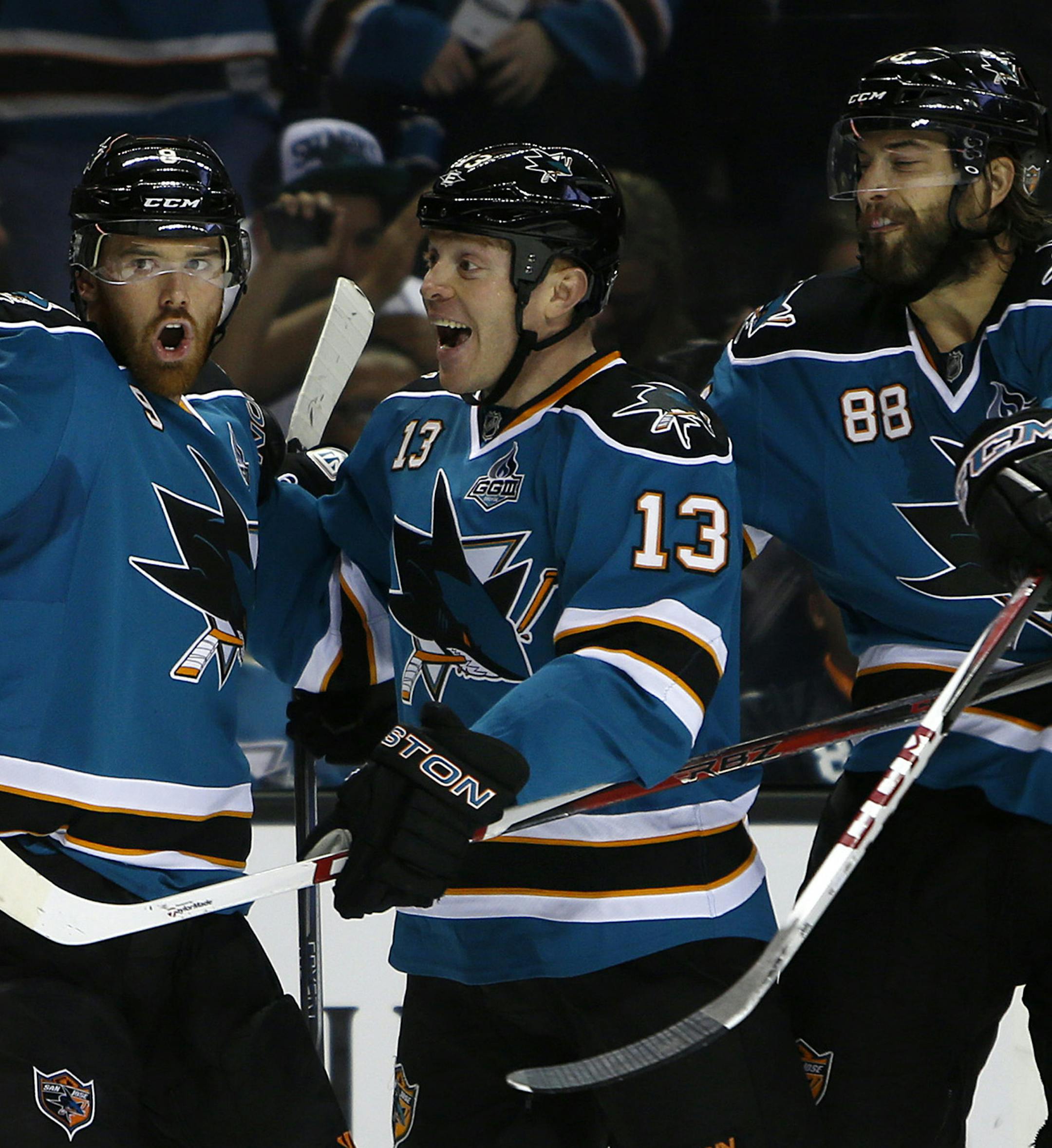 The San Jose Sharks' Raffi Torres (13) celebrates his goal with teammates Martin Havlat (9) and Brent Burns (88) against the Dallas Stars in the first period at HP Pavilion in San Jose, California, on Tuesday, April 23, 2013. (Nhat V. Meyer/San Jose Mercury News/MCT)