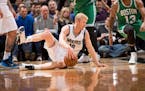 Minnesota Timberwolves forward Chase Budinger (10) goes down to the floor but is able to maintain possession of the ball during the second quarter aga