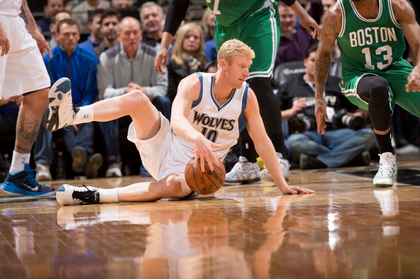 Minnesota Timberwolves forward Chase Budinger (10) goes down to the floor but is able to maintain possession of the ball during the second quarter against Boston. ] (Aaron Lavinsky | StarTribune) The Minnesota Timberwolves play the Boston Celtics Wednesday, Jan. 28, 2015 at Target Center.