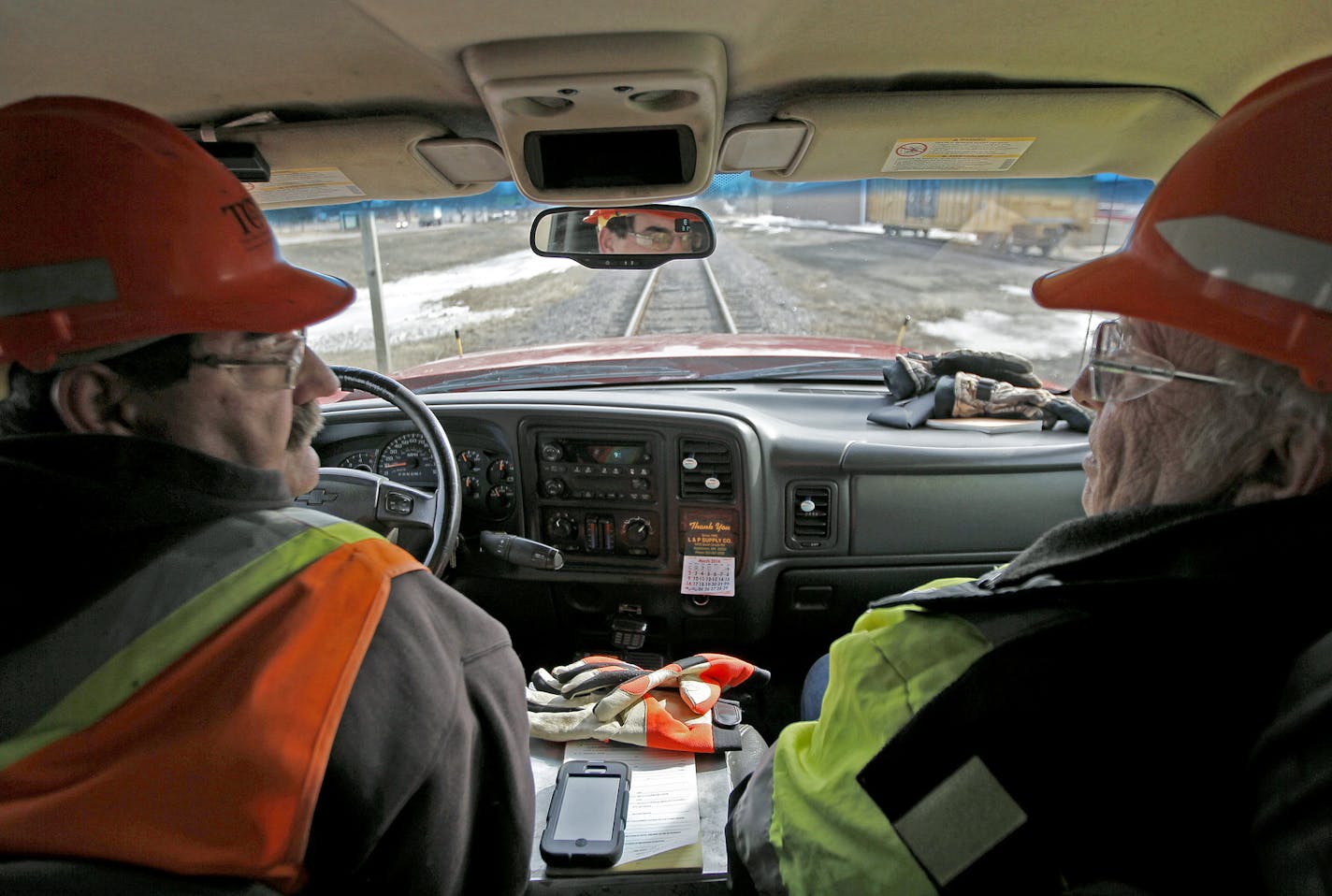 Terry Resick of Twin Cities & Western Railroad, left, and Jim Brandt, rode for miles on the train tracks for inspection near Arlington, MN, Wednesday, March 26, 2014. ] (ELIZABETH FLORES/STAR TRIBUNE) ELIZABETH FLORES &#x2022; eflores@startribune.com