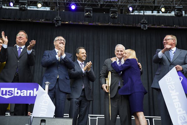 Lester Bagley, from left, the Minnesota Vikings executive vice president of public affairs and stadium development, Vikings co-owners Zygi and Mark Wi