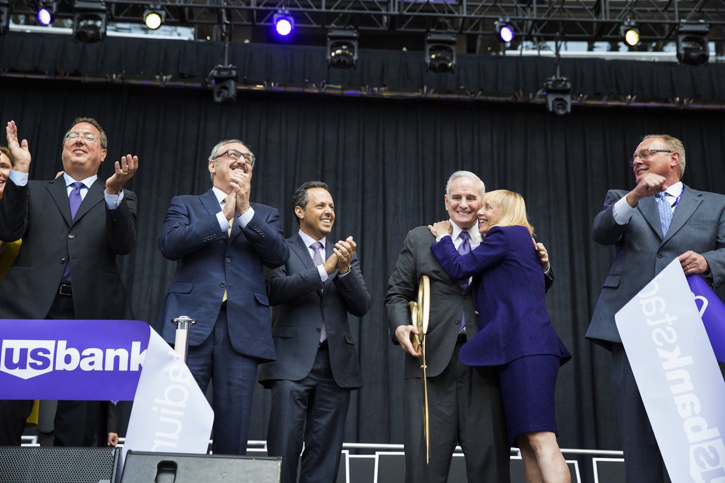 Lester Bagley, from left, the Minnesota Vikings executive vice president of public affairs and stadium development, Vikings co-owners Zygi and Mark Wilf, Governor Mark Dayton, Michele Kelm-Helgen, the chair of the Minnesota-Sports Facilities Authority and Ted Mondale, the CEO of the MSFA celebrate after cutting the ribbon at U.S. Bank Stadium. ] (Leila Navidi/Star Tribune) leila.navidi@startribune.com BACKGROUND INFORMATION: The ceremonial grand opening ribbon cutting for U.S. Bank Stadium in Mi