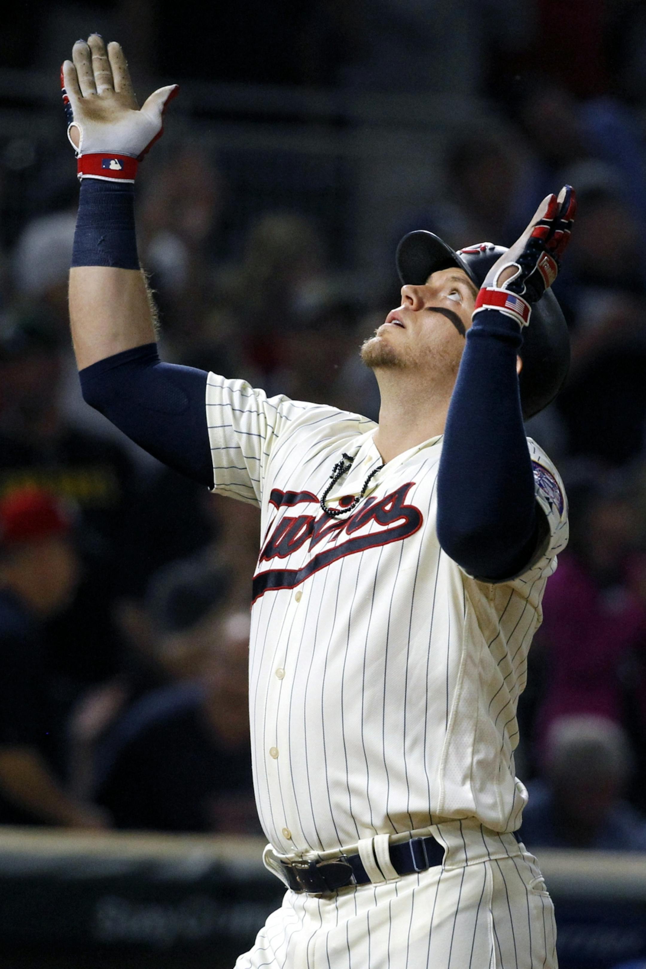Minnesota Twins Logan Morrison celebrates his two-run home run against the Kansas City Royals in the seventh inning of a baseball game Saturday, Aug. 4, 2018, in Minneapolis.