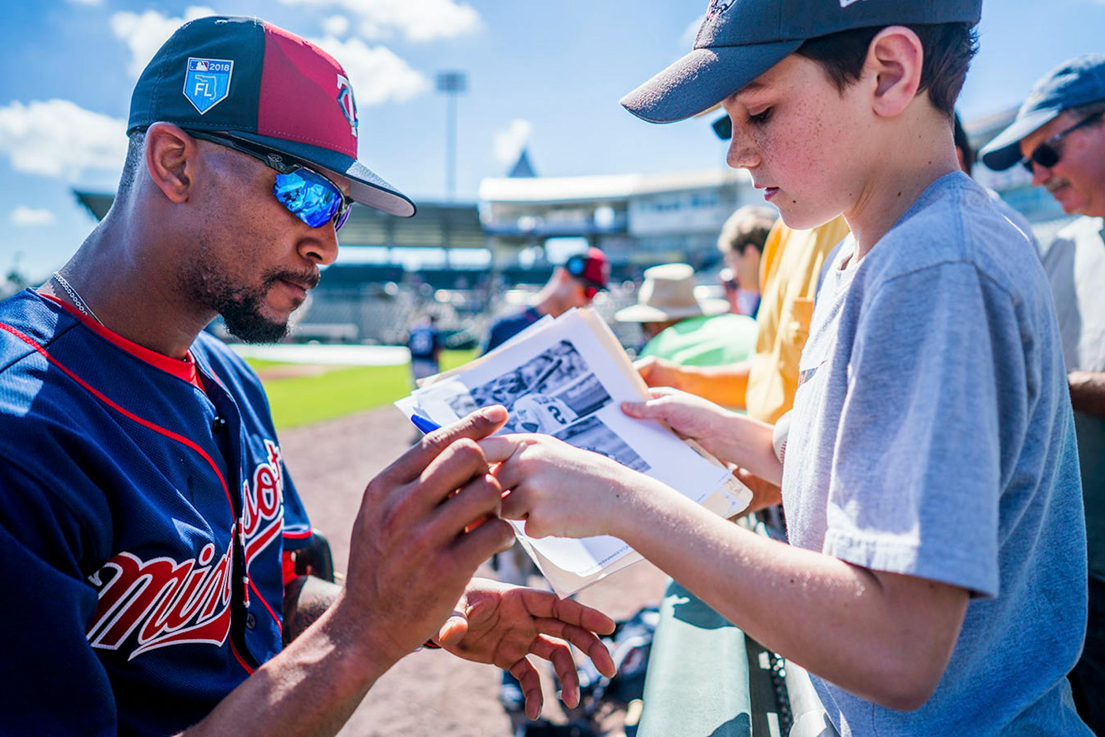 Twins outfielder Byron Buxton (25) signed an autograph for eleven-year-old Michael Mita of Rhode Island.