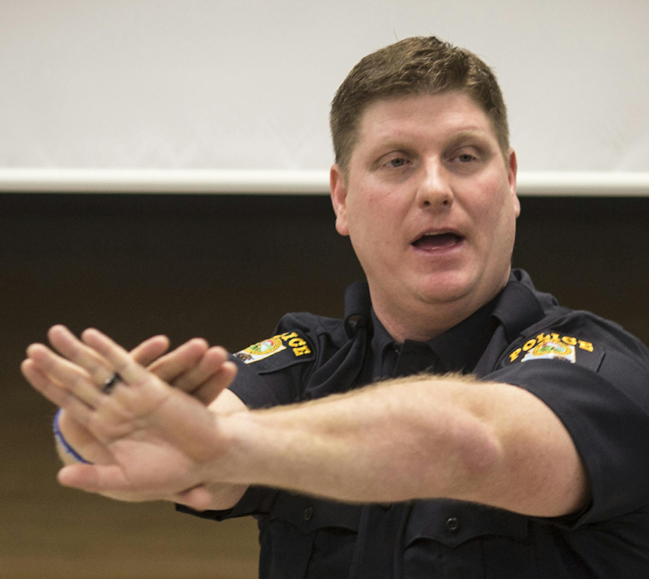 Officer Bryan Platz demonstrated the way to hold your hands during a class for a group of teachers at Coon Rapids High School on Thursday, February 11, 2016, in Coon Rapids, Minn. ] RENEE JONES SCHNEIDER ï reneejones@startribune.com ORG XMIT: MIN1602121213166777