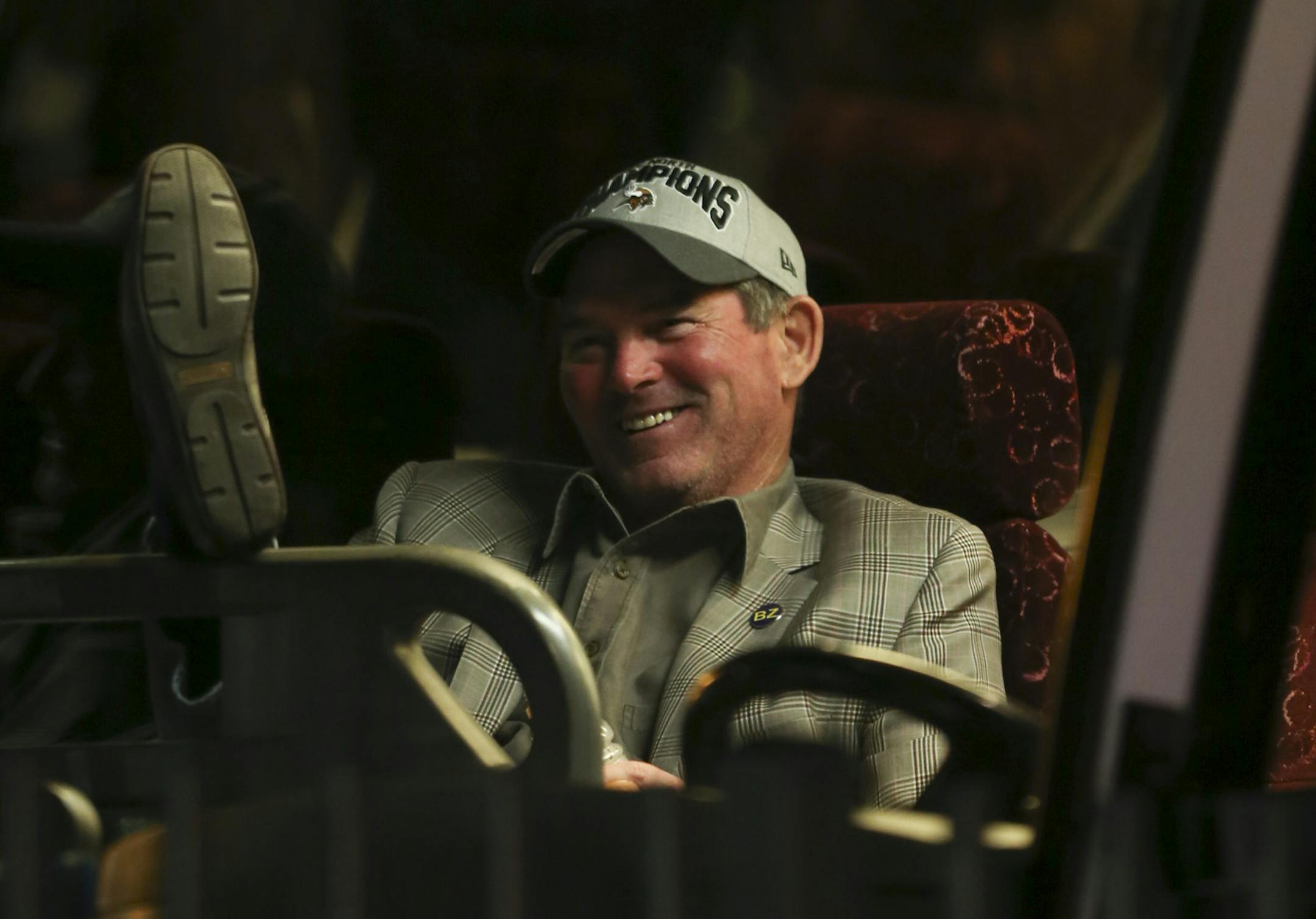 Wearing a division championship cap, Vikings head coach Mike Zimmer relaxed in the front of the bus as the Vikings waited to leave Lambeau Field after defeating the Packers Sunday night. ] JEFF WHEELER &#xef; jeff.wheeler@startribune.com The Minnesota Vikings beat the Green Bay Packers 20-13 in the final regular season game of season Sunday, January 3, 2016 at Lambeau Field in Green Bay, WI.