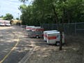 Poor stormwater management by the city of Bloomington has caused repeated flooding to this U-Haul lot, a lawsuit contends.