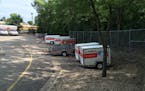 Poor stormwater management by the city of Bloomington has caused repeated flooding to this U-Haul lot, a lawsuit contends.