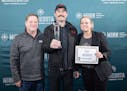 Representatives from Surly Brewing accept the best in show award at the Minnesota Brewers Cup.
