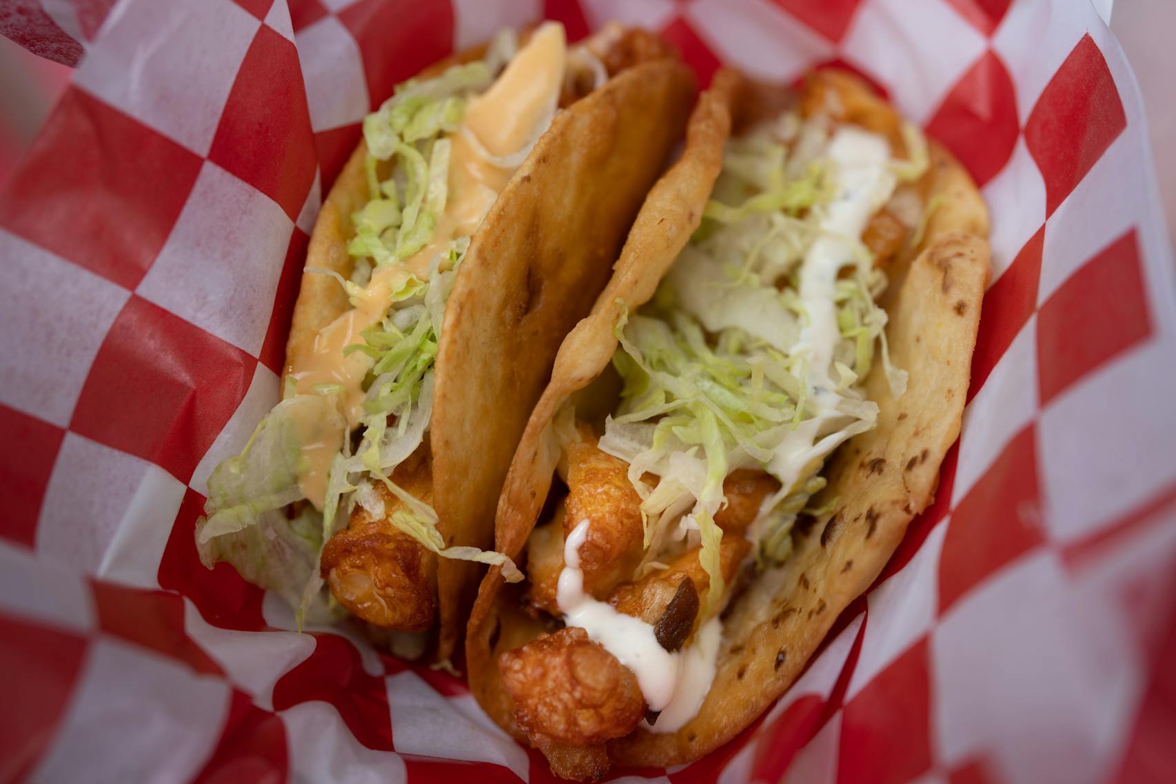 The Original Cheese Curd Taco and Box Checker Cheese Curd Taco from Richie’s Cheese Curd Tacos. New foods at the Minnesota State Fair photographed on Thursday, Aug. 25, 2022 in Falcon Heights, Minn. ] RENEE JONES SCHNEIDER • renee.jones@startribune.com
