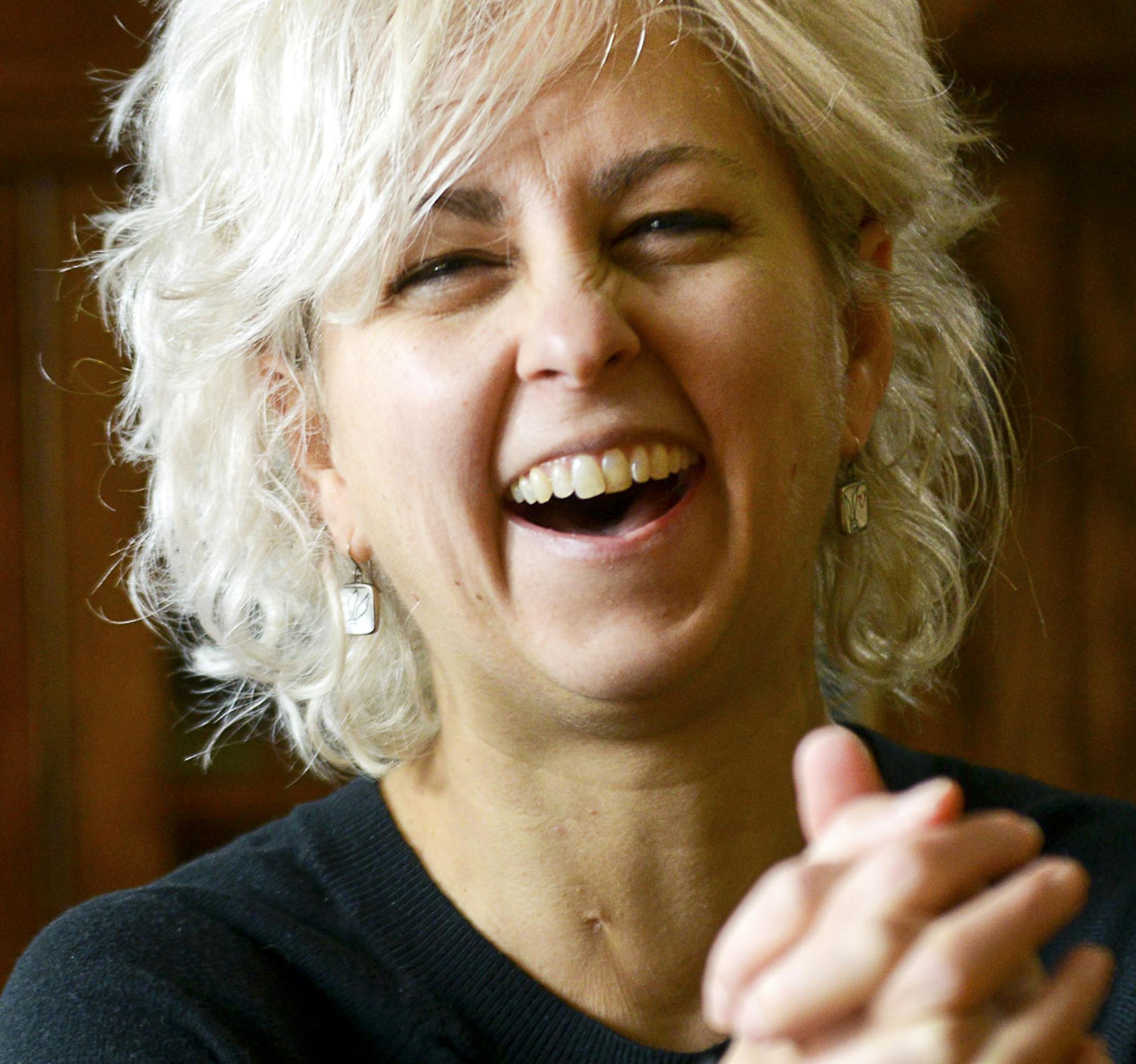 Kate DiCamillo, a Newbery Prize winning author who wrote &#x201a;&#xc4;&#xfa;Because of Winn-Dixie,&#x201a;&#xc4;&#xf9; at her home in Minneapolis, Dec. 20, 2013. DiCamillo is being chosen to serve as the fourth national ambassador for young people&#x201a;&#xc4;&#xf4;s literature, a two-year position that promotes reading through appearances across the nation. (Ben Garvin/The New York Times)