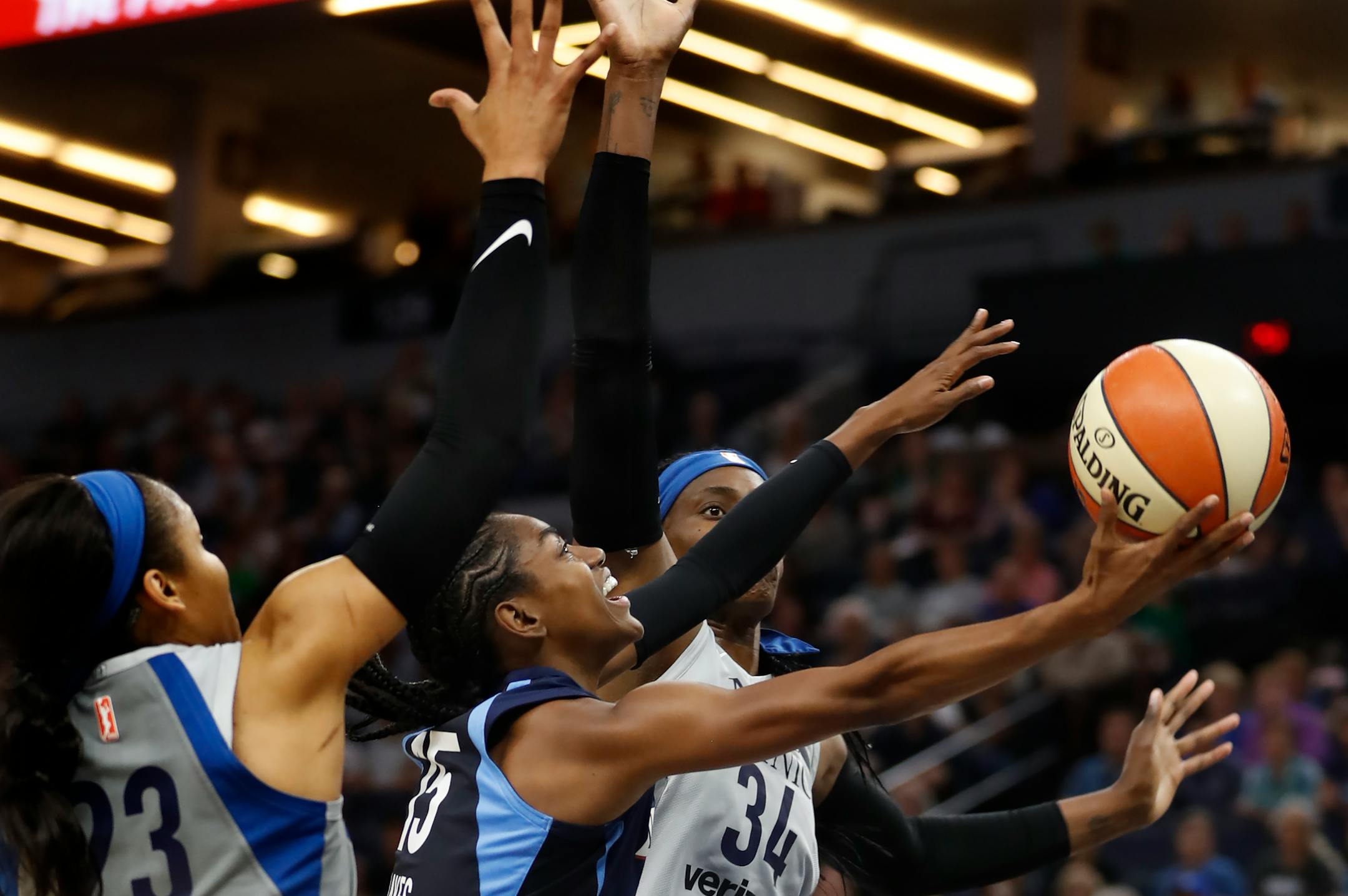 Tiffany Hayes(15) splits the defense of Maya Moore(23) and Sylvia Fowles(34). ] The Minnesota Lynx take on the Atlanta Dream at Target Center on 8/5/18.Richard Tsong-Taatarii�rtsongtaatarii@startribune.com