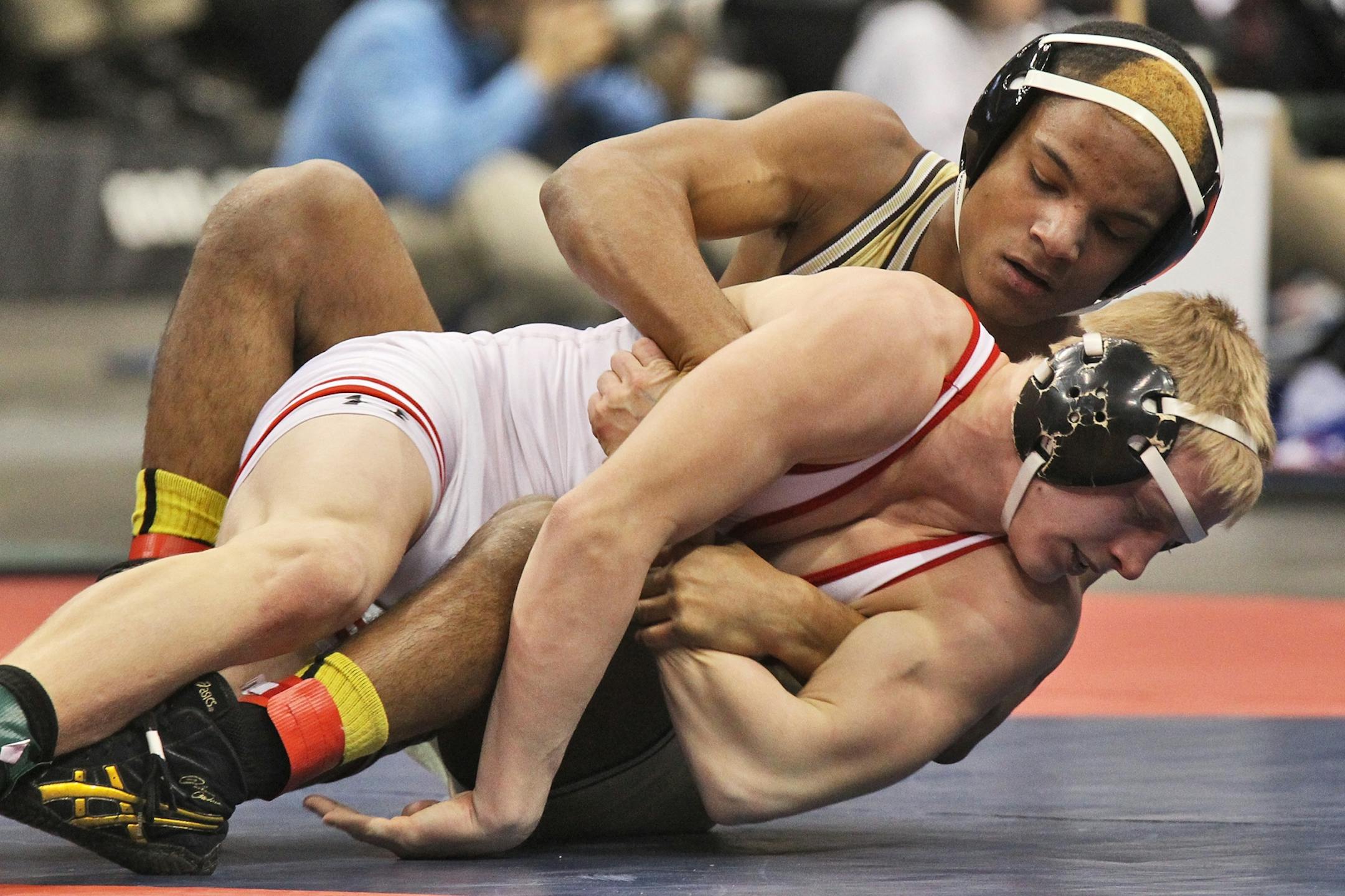 Mark Hall of Apple Valley, top, wrestled Colten Carlson of Wilmar in the Class 3A, 152-lb championship match. Hall, a freshman, won his third state title.