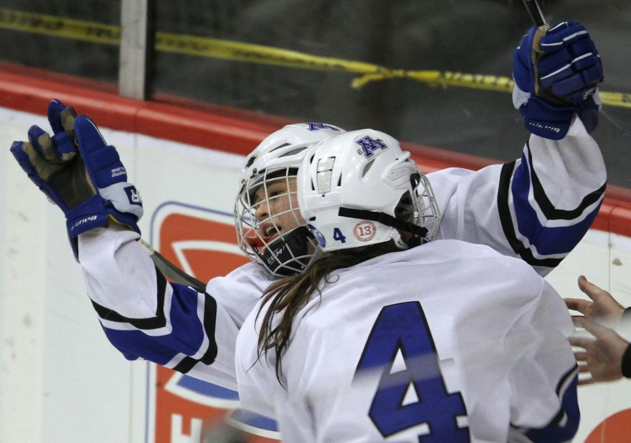 Minnetonka's Amy Petersen, left, celebrated her overtime goal with Diana Draayer.