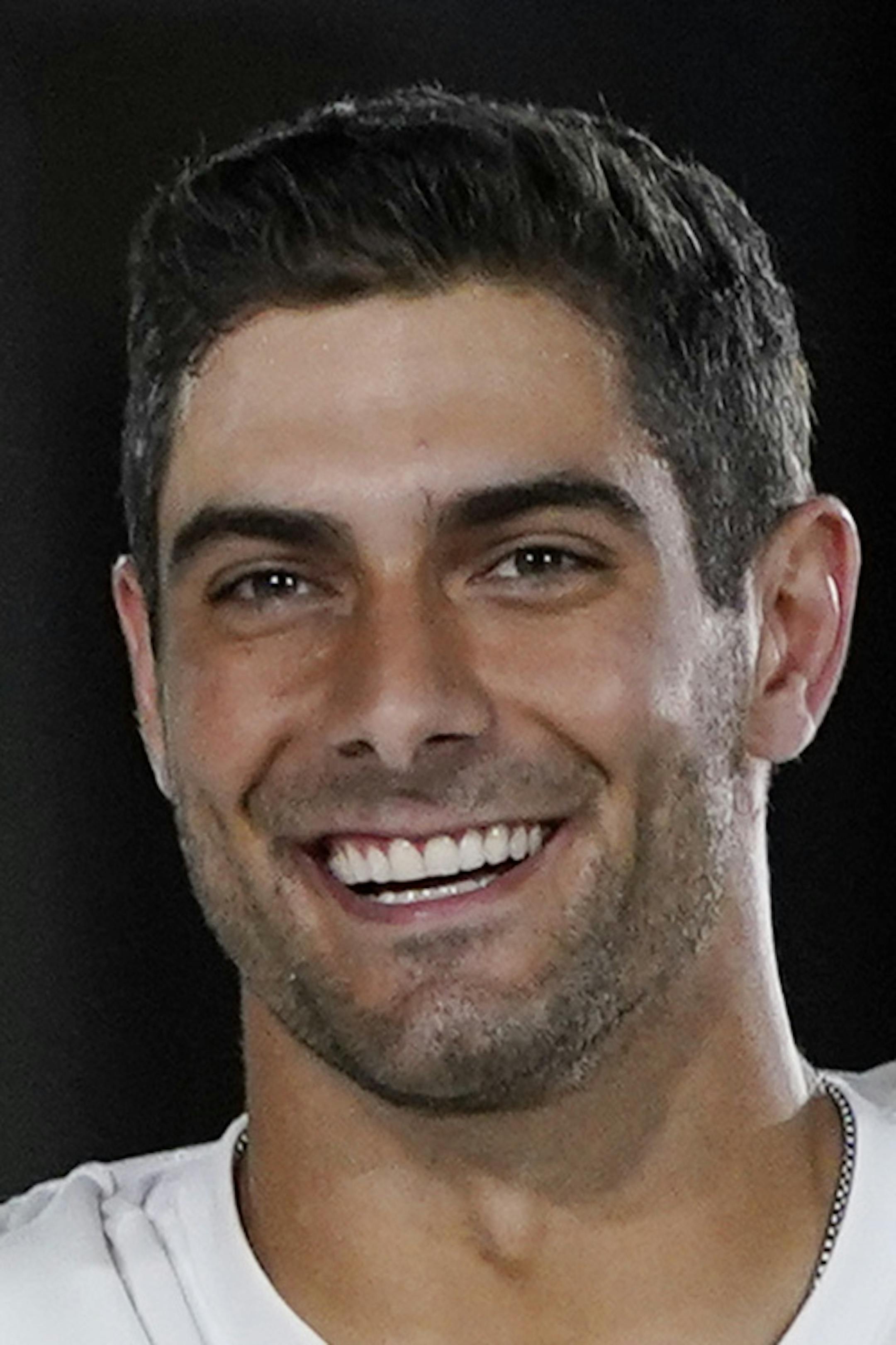 Kansas City Chiefs' Patrick Mahomes, right, chats with San Francisco 49ers' Jimmy Garoppolo during Opening Night for the NFL Super Bowl 54 football game Monday, Jan. 27, 2020, at Marlins Park in Miami. (AP Photo/David J. Phillip)